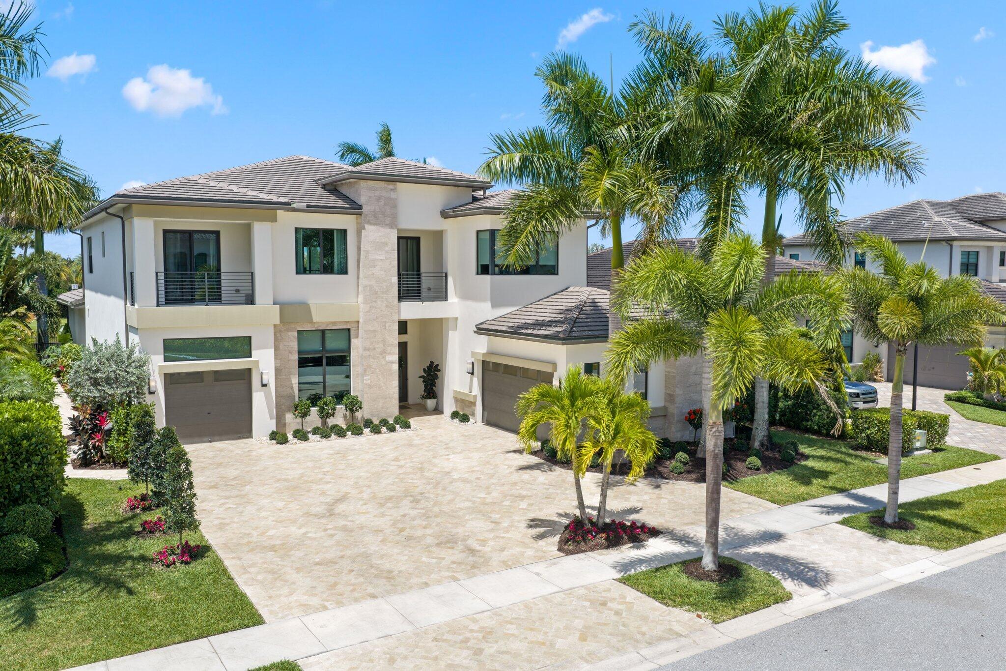 Newly reduced! Welcome to this beautiful, warm and inviting five bedroom home located on a premium lot that was just recently updated to perfection in the prestigious gated community of Boca Bridges in Boca Raton. Thoughtfully designed and masterfully crafted to be the ultimate private retreat, this exceptional home blends luxury, comfort, and tranquility.  At the heart of the home is a gourmet kitchen outfitted with top-of-the-line Sub-Zero and Wolf appliances, and double islands, perfect for both everyday living and entertaining.  The home also offers a movie theater with stadium style seating, a large home office, a cozy upstairs landing area, a bonus room that could double as a second office or music room and more!   The property features an open layout that has been   beautifully re-imagined inside and out, featuring newly upgraded front and rear outdoor spaces with elegant marble pavers, lush turf, a generously sized pool and spa and a truly dreamy backyard oasis. Enjoy your own private slice of paradise with mature mango and avocado trees, creating a serene and tropical setting.  The private backyard offers breathtaking long water views and an extraordinary level of privacy—it feels as though you are surrounded only by nature, with no visible neighbors—just peaceful water and endless calm.  This home offers many upgrades including a full home water filtration system throughout, as well as a full home generator for peace of mind so you will never lose power!   Boca Bridges offers an exceptional lifestyle with world class amenities offered year round including tennis, pickleball, indoor and outdoor basketball, a fitness center, multiple pools, a gourmet restaurant and more!   This home has it all, especially for those who desire comfort but are not willing to sacrifice on luxury living. This one is not to miss!