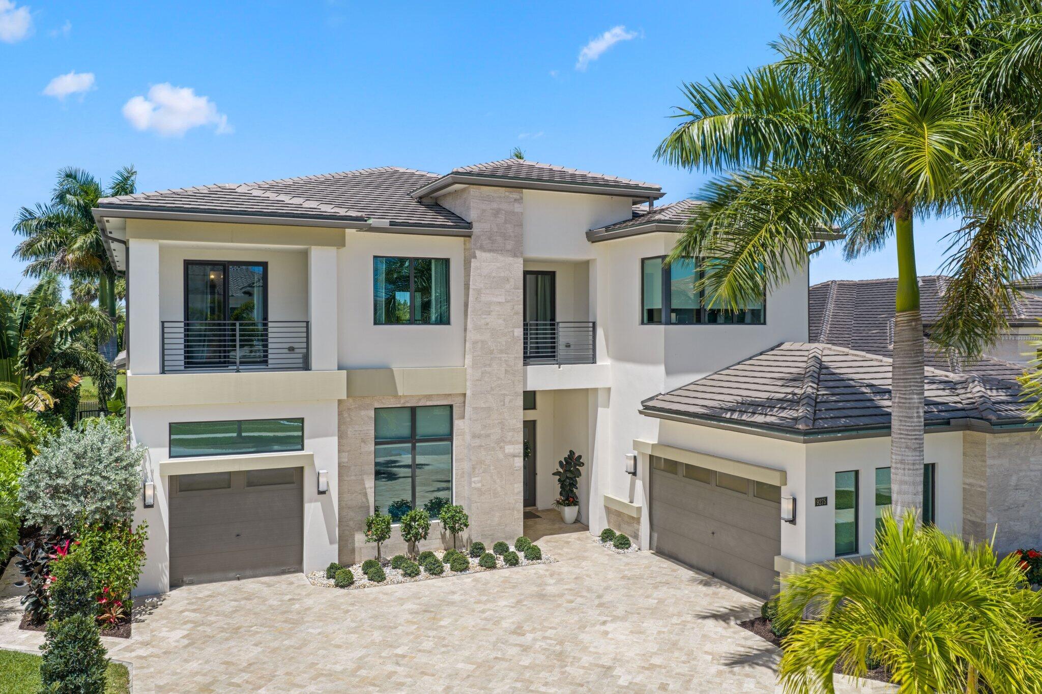 Newly reduced! Welcome to this beautiful, warm and inviting five bedroom home located on a premium lot that was just recently updated to perfection in the prestigious gated community of Boca Bridges in Boca Raton. Thoughtfully designed and masterfully crafted to be the ultimate private retreat, this exceptional home blends luxury, comfort, and tranquility.  At the heart of the home is a gourmet kitchen outfitted with top-of-the-line Sub-Zero and Wolf appliances, and double islands, perfect for both everyday living and entertaining.  The home also offers a movie theater with stadium style seating, a large home office, a cozy upstairs landing area, a bonus room that could double as a second office or music room and more!   The property features an open layout that has been   beautifully re-imagined inside and out, featuring newly upgraded front and rear outdoor spaces with elegant marble pavers, lush turf, a generously sized pool and spa and a truly dreamy backyard oasis. Enjoy your own private slice of paradise with mature mango and avocado trees, creating a serene and tropical setting.  The private backyard offers breathtaking long water views and an extraordinary level of privacy—it feels as though you are surrounded only by nature, with no visible neighbors—just peaceful water and endless calm.  This home offers many upgrades including a full home water filtration system throughout, as well as a full home generator for peace of mind so you will never lose power!   Boca Bridges offers an exceptional lifestyle with world class amenities offered year round including tennis, pickleball, indoor and outdoor basketball, a fitness center, multiple pools, a gourmet restaurant and more!   This home has it all, especially for those who desire comfort but are not willing to sacrifice on luxury living. This one is not to miss!