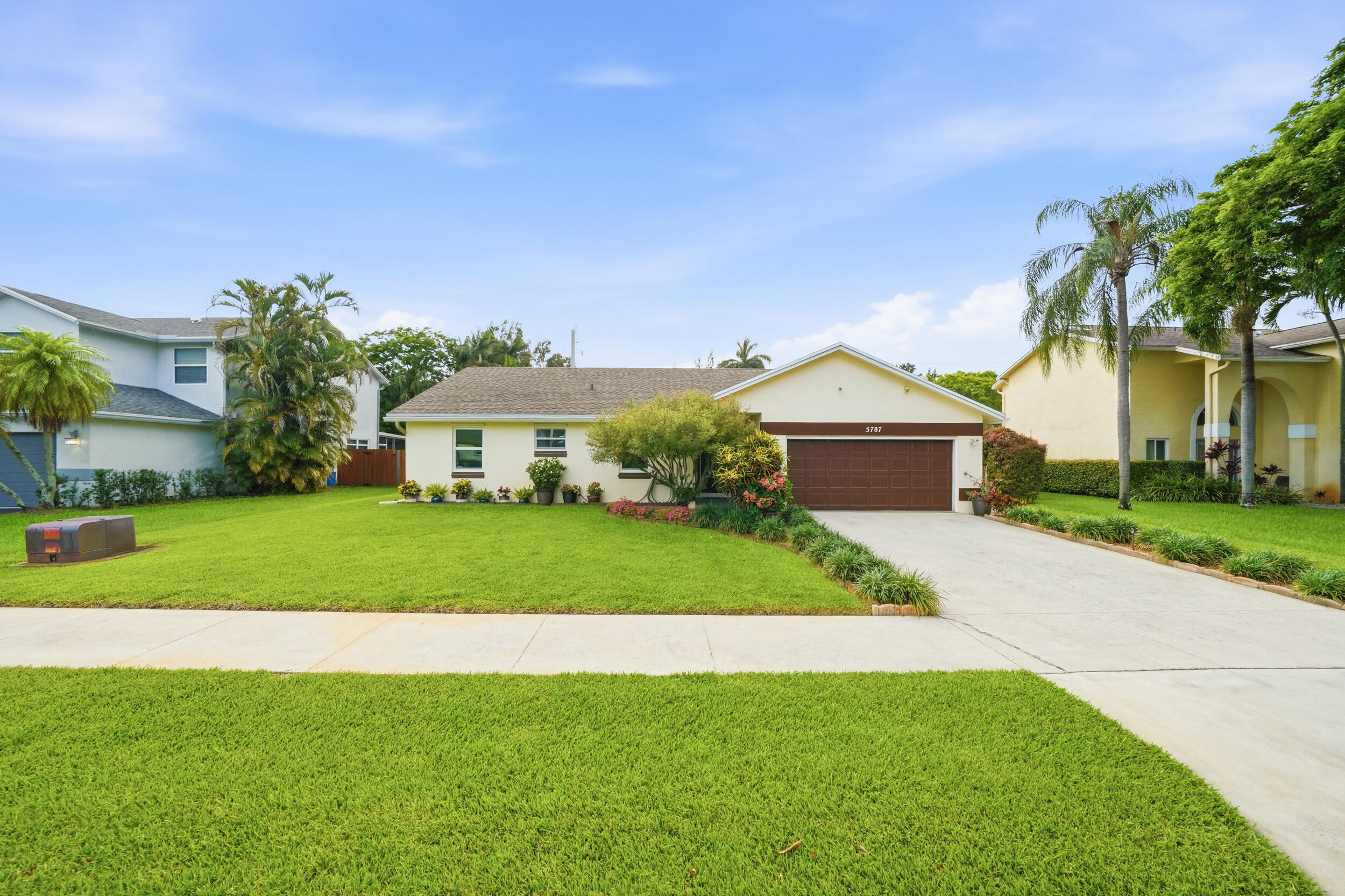 RARELY AVAILABLE in one of Davie's most desirable communities with extremely limited turnover! Situated on an oversized, fully fenced lot, this move-in ready home offers vaulted ceilings and oversized windows & doors that fill the home with natural light. The split floor plan features multiple living areas, providing flexibility for everyday living and entertaining. Enjoy indoor/outdoor living with a spacious screened porch overlooking your private garden and manicured lawn. The primary suite features a walk-in closet and direct porch access through sliding glass doors. Freshly painted with updated fixtures. Major updates include 2019 IMPACT windows and doors, 2018 fence, 2014 HVAC, and 2014 water heater. LOW HOA and an unbeatable location!
