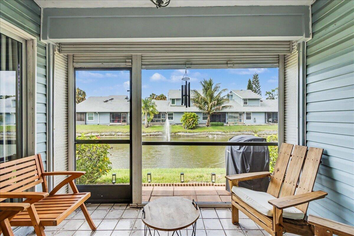 Ideally located in a quiet, well-maintained community just minutes from I-95 and the beach, this move-in-ready residence offers beautiful water views and an exceptional South Florida lifestyle. The home features an updated kitchen, renovated bathrooms, and skylights that fill the interior with natural light, creating a bright and inviting living space. A new A/C system installed in 2025 provides added value and peace of mind. Enjoy serene water views and resort-style community amenities including a sparkling pool and tennis courts. The HOA provides exceptional value by covering building insurance, roof maintenance, and landscaping, making ownership easy and convenient. Whether you're seeking a primary residence, seasonal getaway, or a great investment opportunity.