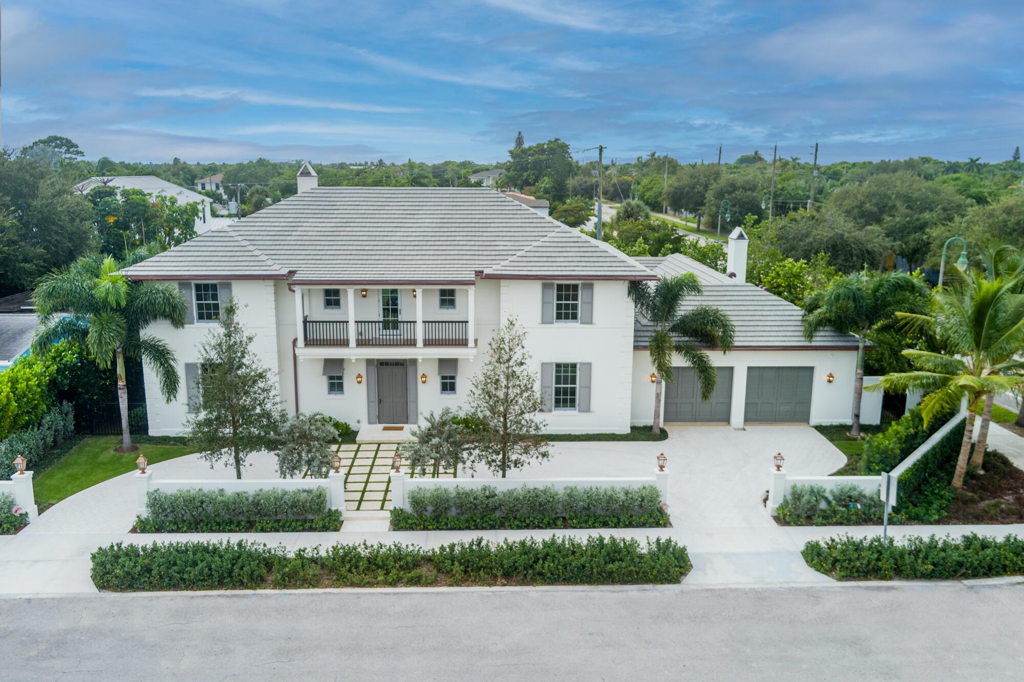 Introducing an extraordinary new construction home in the coveted SoSo neighborhood, set on a generous 12,332 sq ft lot. This stunning residence, designed by renowned Fairfax Sammons Architects, constructed by Cury Group and beautifully appointed by Hive and McCann Design Group, seamlessly merges luxurious design with modern amenities. The home features 5 bedrooms and 5.5 bathrooms, including a spacious primary suite with dual closets and a convenient coffee bar. Elegant hardwood and marble floors flow throughout, enhancing the home's sophisticated ambiance. Designed for both comfort and convenience, this property includes an elevator, a double-stacking washer/dryer laundry room on the first floor, a washer/dryer on the second floor, a full-house generator.... ...air-conditioned double garage and ample driveway.
As you step into through the foyer, you are greeted by a large formal living space with 10.5 ft coffered ceilings and a gas fireplace. A fully equipped wet bar leads to the oversized chef's kitchen designed by Downsview, complete with a six-burner Wolf range, Subzero refrigerator/freezer, two Bosch dishwashers, large walk-in pantry and dual sinks ideal for hosting memorable gatherings. The second living space off the kitchen features 11.5 ft vaulted ceilings, gas fireplace and dining area.
Outside, you'll find two covered loggias and an upper balcony that provide peaceful views of the large heated pool and landscaped garden. 
Located just steps from the picturesque Flagler Drive, Summa Beach and South Olive Park and Tennis, this home offers the perfect blend of luxury and an enviable location.