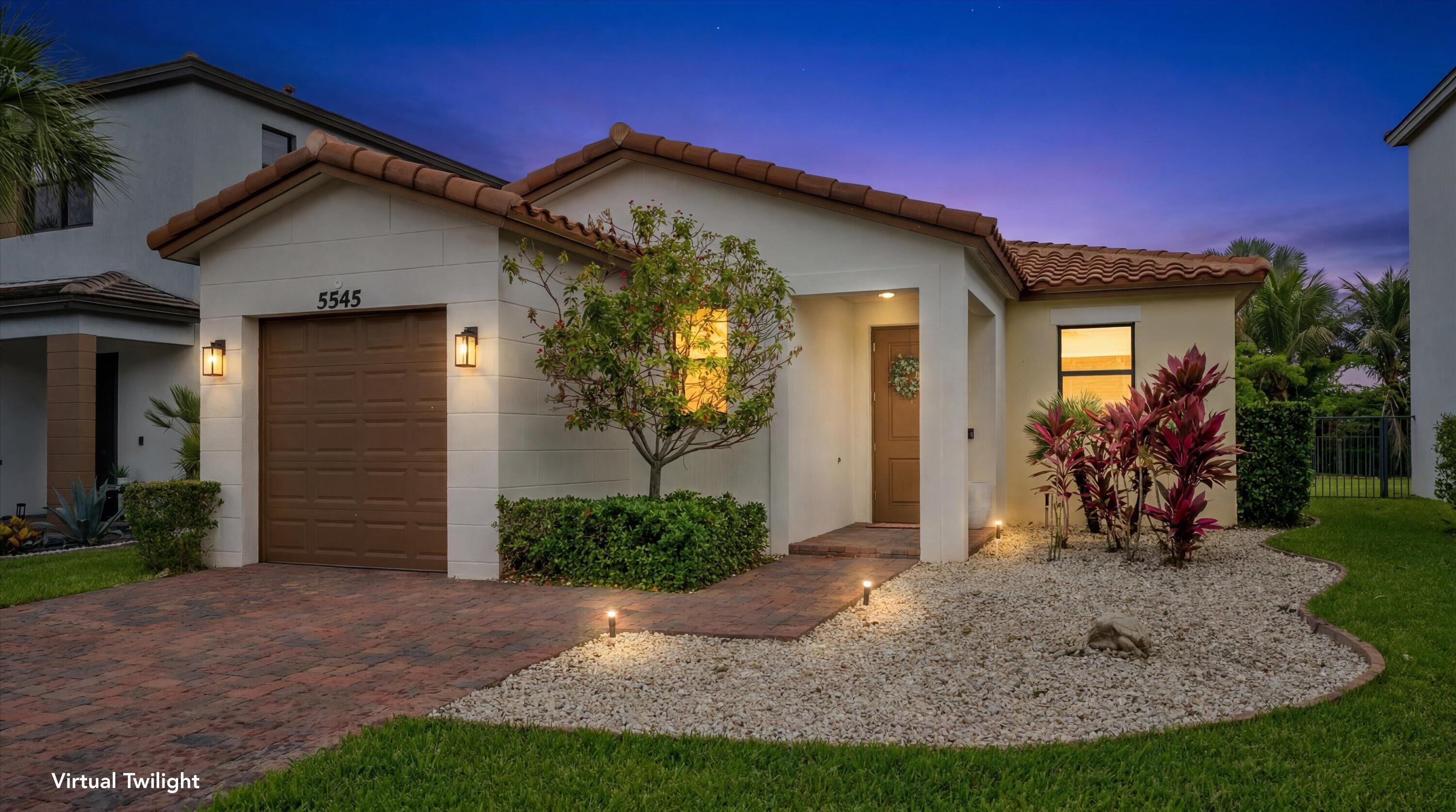 Welcome to Skycove at Westlake, where style, comfort, and functionality come together in this beautifully maintained one-story home. Offering 3 bedrooms, 2 bathrooms, and a 1-car garage, this move-in-ready residence features exceptional curb appeal with lush landscaping and a spacious two-car driveway. Step inside to discover bright, crisp white walls complemented by beautiful laminate flooring that flows throughout the main living areas. The open-concept layout is centered around a stunning kitchen featuring white shaker cabinetry, quartz countertops, a designer backsplash, stainless steel appliances, and an upgraded refrigerator. The kitchen seamlessly overlooks the dining and living areas, creating the perfect space for entertaining. A custom-designed accent TV wall adds a stylish focal point to the living room.  The spacious primary suite offers plush carpeting, elegant lighting fixtures, and plenty of room to relax. The en-suite bathroom is beautifully appointed with white shaker cabinets, quartz countertops, and a glass-enclosed walk-in shower. Two additional bedrooms feature carpeting, abundant natural light, and share a well-appointed bathroom complete with a tub/shower combination, white shaker vanity, and quartz countertops.  Additional interior features include window blinds throughout, a dedicated laundry room with washer and dryer included, and impact-resistant windows for added peace of mind and energy efficiency.  Step outside to enjoy the expanded paver patio and an oversized fenced backyard, providing ample space for outdoor entertaining, pets, play, or future customization. Located in the highly desirable Skycove community, this home offers modern finishes, thoughtful upgrades, and the opportunity to enjoy everything that Westlake living has to offer.