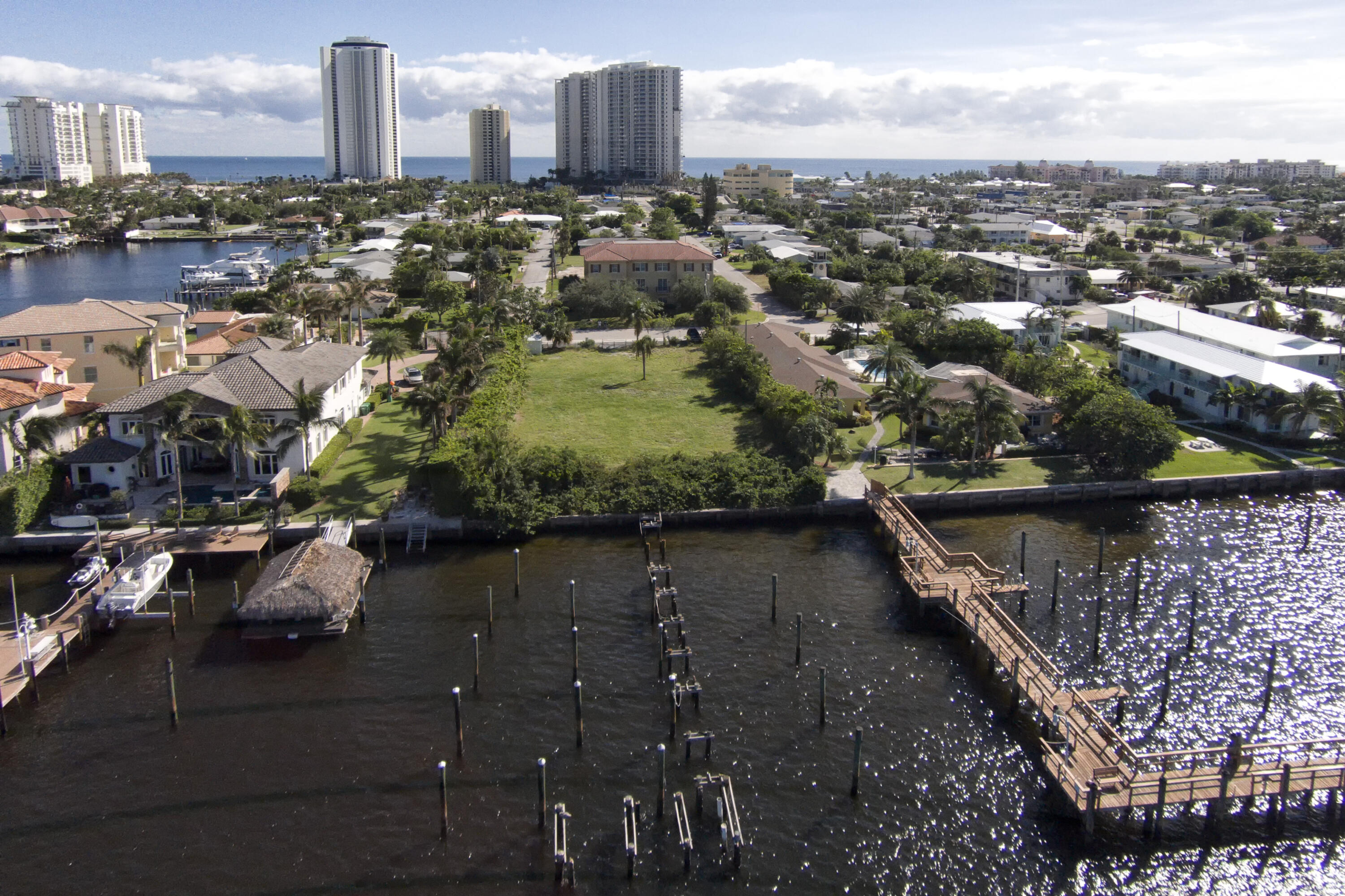 Single family residential lot or RM-15 (up to 7 units), 5 units without council approval, over 5 units needs site plan approval (6-8 months minimum or up to 1 year).  35' maximum height, 7' side setbacks.
New submerged land lease with State of FL for 6 docks.  Lease gets renewed every 5 years.  Seller awaiting final letter for this 5 year approval.  We have approval letter in hand, happy to share.
Vacant land, easy to show.
Please confirm school boundaries, school information not guaranteed.