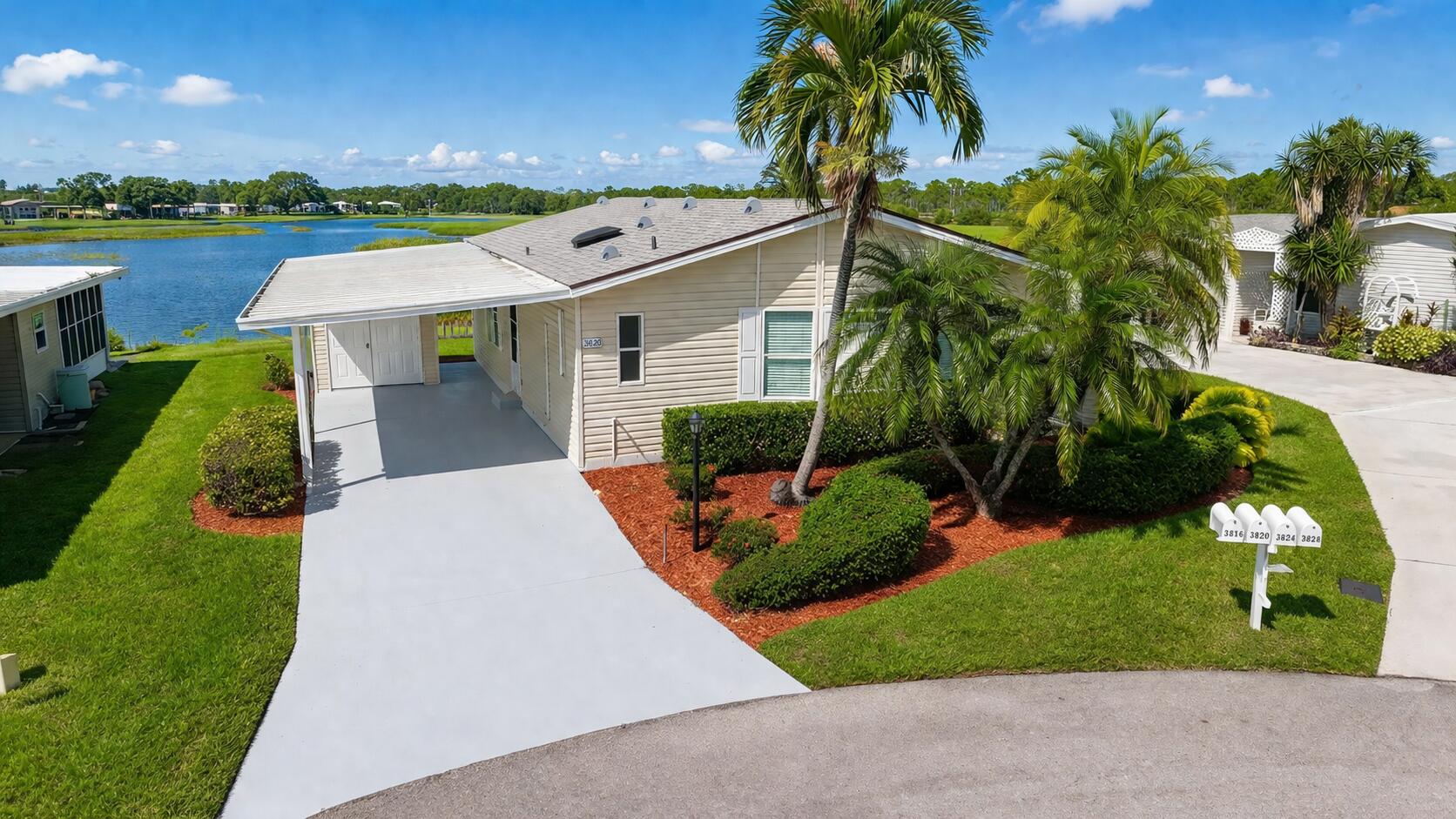 NEW PRICE! TURN-KEY FULLY RENOVATED WATERFRONT HOME WITH NEW 2025 ROOF AND MAJOR UPGRADES COMPLETED. Beautiful 2BR/2BA with an open layout connecting the living, dining, and kitchen areas to an enclosed lanai, offering water views throughout. Truly move-in ready with luxury vinyl flooring, smooth walls and ceilings (no paneling), fresh interior paint, stainless steel appliances, washer and dryer, new vapor barrier and tie-downs, and an enclosed lanai with A/C. Major systems already completed, minimizing future repair concerns and eliminating the need for immediate renovations. The overall condition stands out compared to most homes currently available in Savanna Club. Located in an active 55+ community with multiple clubhouses. Conveniently located near beaches. Golf cart included plus outdoor lanai furniture and BBQ. Modern fans and fixtures throughout. Oversized storage shed and sprinkler system on well water. Enclosed lanai offers a private setting ideal for relaxing or entertaining. Savanna Club features three clubhouses, swimming pools, fitness centers, tennis courts, golf, on-site dining, live entertainment, and social events. Optional RV and boat storage available. HOA includes cable, internet, trash removal, and full access to amenities. Easy to show.
