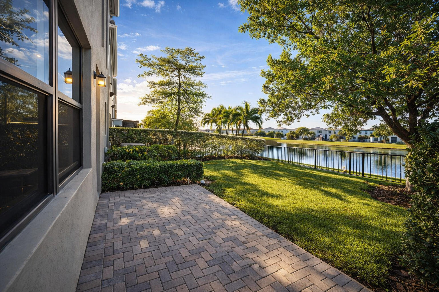 This professionally remodeled two-story lakefront residence sits in a secure, highly sought-after gated community, Aventura Isles in Miami. The interior features premium finishes throughout, including porcelain floors, designer lighting, custom cabinets and accent walls. The open-concept main level connects a spacious living and dining area to an upgraded gourmet kitchen, ideal for entertaining and daily living. The primary suite offers tranquil lake views, a tray ceiling, and a luxurious walk-in closet fully built out with custom shelving and LED detail lighting. Spa-inspired bathrooms boast LED mirrors, stone vanities, frameless glass showers, and designer fixtures. Additional highlights include a laundry room with generous cabinetry, a two-car garage finished with an epoxy floor and dramatic LED hexagon lighting, and a large lakefront yard perfect for relaxing or future outdoor enhancements. The home is completed with custom finishes throughout and is positioned to take full advantage of serene water vistas from multiple angles. Community amenities emphasize security and lifestyle: gated, controlled-access streets, lush landscaping, lakes and walking paths, playgrounds, dog park, tennis courts, community pool and a family-friendly environment. Conveniently located near top schools, major highways, shopping, and dining.