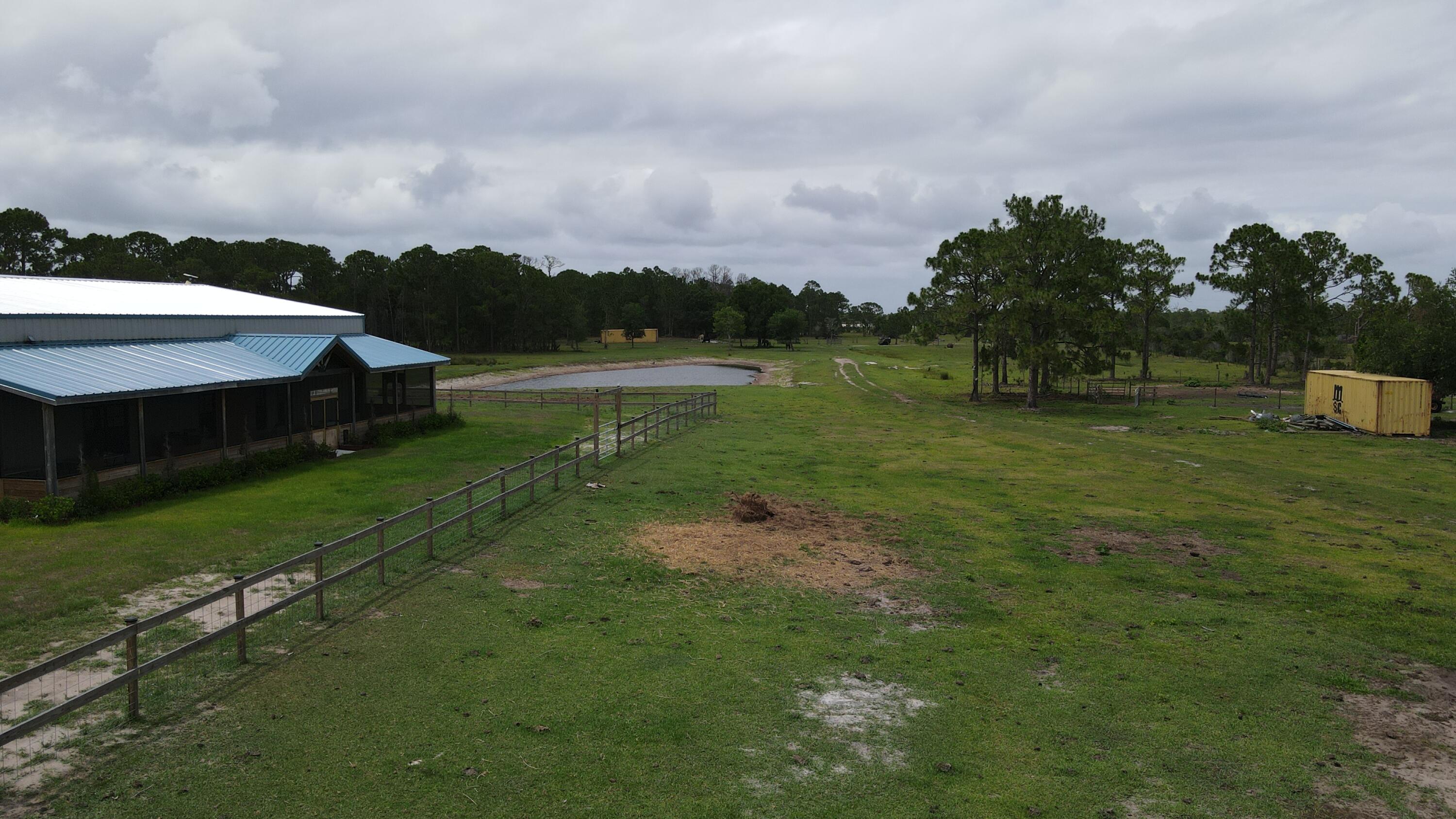 25.72 acres fenced with house pad, automatic gates, new ponds. Pine woods and open pasture. Electric with well and septic in place. Property ready to build new home with concrete slab and housepad for over 5500 square feet of home.