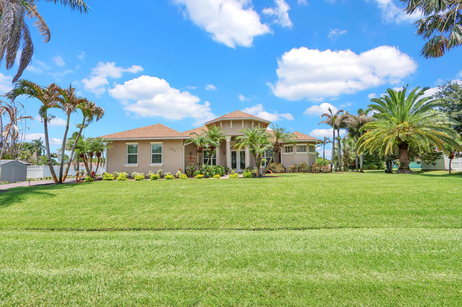 RARE FIND and MOTIVATED SELLER! NO HOA. Spectacular Model perfect home.  4 bdrm, 2 bath, 3 CAR  GARAGE, heated salt water pool complete with waterfalls! New hurricane proof screen enclosure. Fresh paint 2025, Volume lighted tray in living and coffered ceilings with dbl crown mouldings. Guest bath features a jacuzzi tub while the Master boast a soaking tub with walk in walk out shower,dual sinks .and private water closet. Walk in closets .Complete Impact windows, 2023 roof. New Kitchen 2025, cabinets, granite tops. Guest bath features a  Jacuzzi tub and Master has a Roman soaking tub with separate walk through shower.Utility shed .City water, city sewer plus well water sprinklers system onsite for a  spectacular lush lawn.This home is immaculate. Don't wait it won't last!