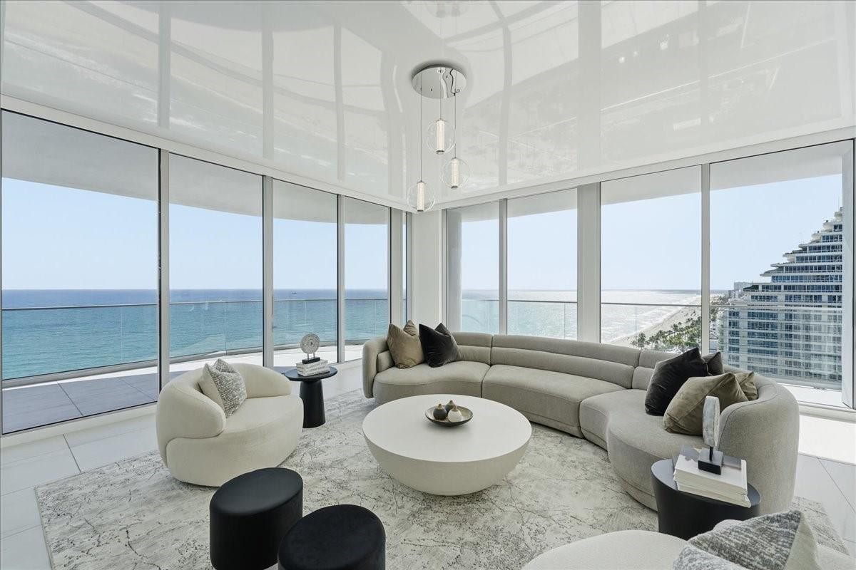Fully furnished (not staged). THIS DESIGNER MODEL is OPEN DAILY by appointment. DIRECT OCEANFRONT / SOUTHEAST CORNER of EAST BUILDING. Brand New, Move right in!   4 sleeping areas with 4 FULL BATHS. Note that one sleeping area is a den/media room. OVER 3000 SQ ft. 2 valet garage spaces, included. Wonderful amenities that include 2 pools, state of the art gym, gorgeous community rooms, theater, virtual golf and sports room.  PET FRIENDLY. E-A-S-Y to SEE.