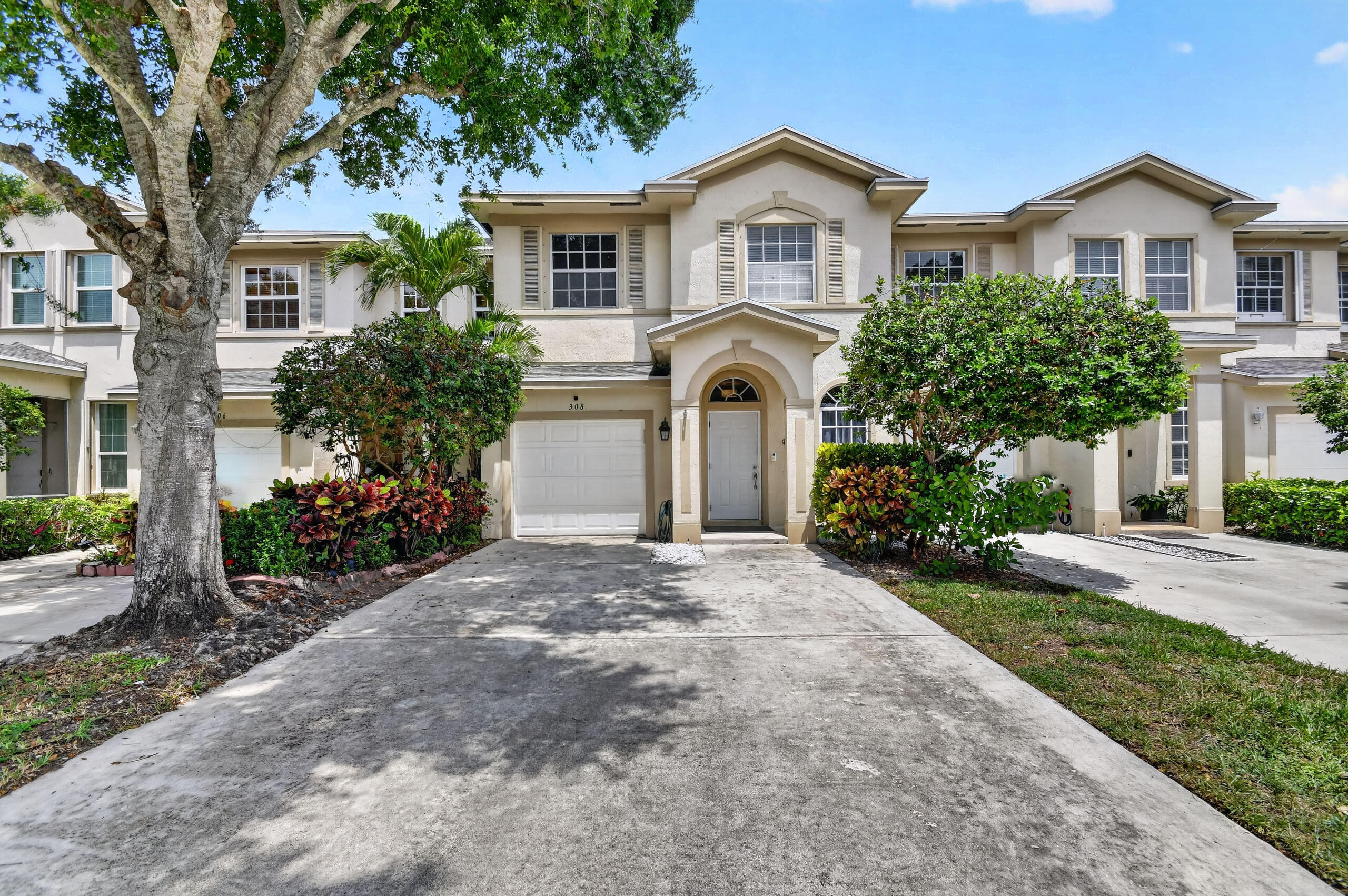 Welcome to this beautifully maintained and RARELY AVAILABLE 4 bedroom 3  1/2 bathroom townhome with a one car garage, located in the desirable gated community of Cedar Ridge Estates in Boynton Beach. Designed with both comfort and functionality in mind, the fully remodeled first floor features an updated kitchen with new stainless steel appliances, a spacious living and dining area, a separate family room and convenient half bath and dedicated laundry room., and Tesla charger. Step outside to your private patio and unwind while enjoying peaceful lake views. Upstairs, you will find all four bedrooms, including a spacious primary suite with a walk in closet and large en suite bath,. A second bedroom also features its own en-suite bath, while the remaining two bedroom share a full bathroom.