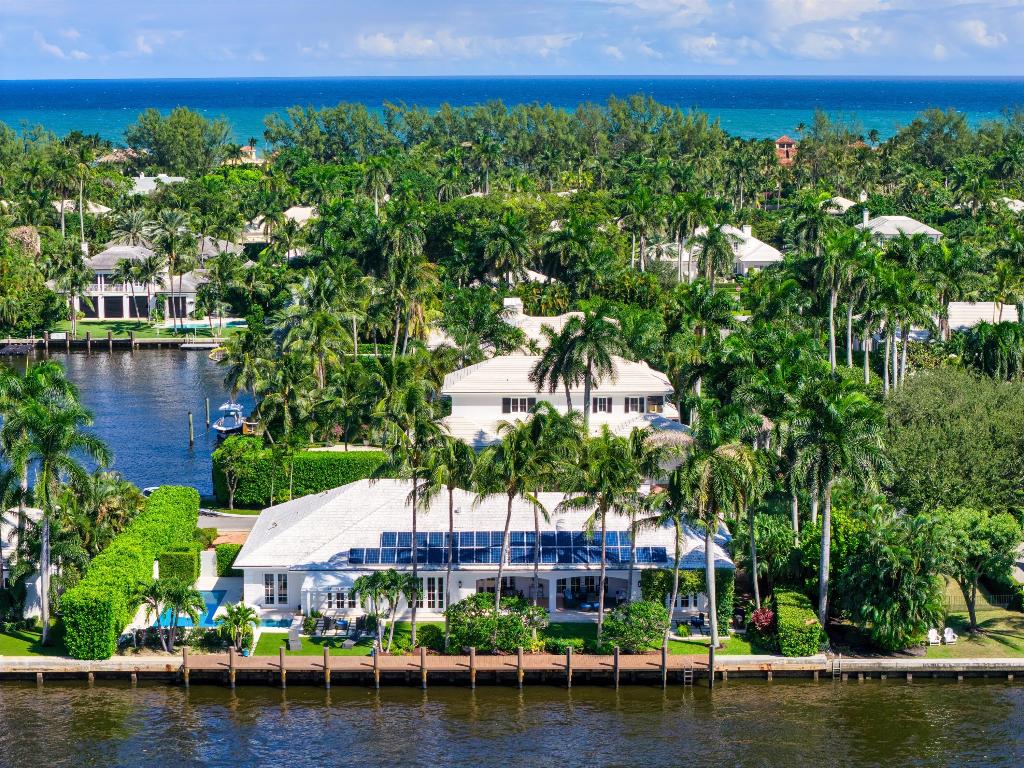 This totally renovated Bermuda-inspired estate combines architectural refinement, modern amenities, and the serenity of a prime Intracoastal location.
Every detail has been thoughtfully designed for comfort, privacy, and effortless waterfront living—making this a truly exceptional Gulf Stream residence. Totally renovated since 2016, this exquisite Bermuda-style home offers 150 feet of direct Intracoastal frontage in the highly sought-after town of Gulf Stream. Tucked away on a quiet cul-de-sac, the property sits across from a private bay, creating a tranquil coastal retreat that perfectly blends privacy, elegance, and the beauty of waterfront living. 566 Palm Way, Gulf Stream, Florida: Established as an exclusive winter resort in the 1920's, Gulf Stream is a hidden gem in the heart of South Florida's fabled Gold Coast. This quiet oceanfront hamlet, prized for exceptional quality of life and historic charm, is served by a winding stretch of Ocean Boulevard, canopied with Australian pines, that has been designated a Historic Scenic Highway. 

PROPERTY: 

On a cul-de-sac across the street from a private bay on a beautifully landscaped parcel, an old-brick driveway circles around a verdant oasis to the entry and two-bay garage creating a gracious first impression. In the turf-carpeted hedged backyard, the loggia, with a cypress-wood ceiling, flows out to the salt/chlorination heated pool and spa. Ideal for watersport enthusiasts, this residence fronts 150± feet directly on the Intracoastal with a 110± -foot composite dock. 
 
RESIDENCE:  

Capturing the ease and elegance of a refined lifestyle, this 5,454± total square foot, four-and-a-half-bath Bermuda-style residence, renovated since 2016, abounds with stunning features throughout. Within the sunlit interiors of its well-proportioned rooms, the clean neutral color palette is complemented by handsome hardwood flooring, while volume ceilings with cove lighting augment a sense of spaciousness. Banks of French doors from every major room create a seamless flow between inside and out, offering breathtaking views of the Intracoastal Waterway. Inviting gracious entertaining, the formal living room is anchored by the gas fireplace with a carved stone mantel, which can also be enjoyed from the adjoining dining room. Offering endless potential for family living and more informal gatherings are the open-concept family room, kitchen and breakfast area. A detail in the family room is a built-in bar with a refrigerator. Designed for culinary creation and connection, the gourmet kitchen, with two islands, is finished with high-end appliances,  custom cabinetry and quartzite tops and backslashes. A perfect retreat for creative work or peaceful privacy, a handsome paneled library features built-in bookcases and offers views of the front gardens. The primary suite serves as a tranquil sanctuary, with French doors that open to the private water-view pergola. The suite comprises two custom-fitted walk-in closets and a spa-like bathroom, with dual custom wood vanities topped by marble, a glass-enclosed shower with seating, a separate soaking tub and two toilet rooms. Set aside in the opposite wing, a guest bedroom suite also opens to the pool area, while off the foyer, two additional guest bedroom suites offer views of the front gardens. Completing the layout are a half-bath, mud room and laundry room. Amenities include a full house generator, propane gas with 1,000-gallon tank and two air-conditioning systems only two years old. With its private Gulf Stream setting, masterful design and remarkable Intracoastal views, this estate is a place where dreams take root.



Breakfast area chandelier excluded from sale.

The information herein is deemed reliable and subject to errors, omissions or changes without notice.  The information has been derived from architectural plans or county records. Buyer should verify all measurements
DISCLAIMER: Information published or otherwise provided by the listing company and its representatives including but not limited to prices, measurements, square footages, lot sizes, calculations, statistics, and videos are deemed reliable but are not guaranteed and are subject to errors, omissions or changes without notice. All such information should be independently verified by any prospective purchaser or seller. Parties should perform their own due diligence to verify such information prior to a sale or listing. Listing company expressly disclaims any warranty or representation regarding such information. Prices published are either list price, sold price, and/or last asking price. The listing company participates in the Multiple Listing Service and IDX. The properties published as listed and sold are not necessarily exclusive to listing company and may be listed or have sold with other members of the Multiple Listing Service. Transactions where listing company represented both buyers and sellers are calculated as two sales. "No payments made until title passes" Some affiliations may not be applicable to certain geographic areas. If your property is currently listed with another broker, please disregard any solicitation for services. Information published or otherwise provided by seller, listing company or its representatives is deemed reliable but are not guaranteed and subject to errors, omissions, or changes without notice. Copyright 2025 by the listing company. All Rights Reserved.