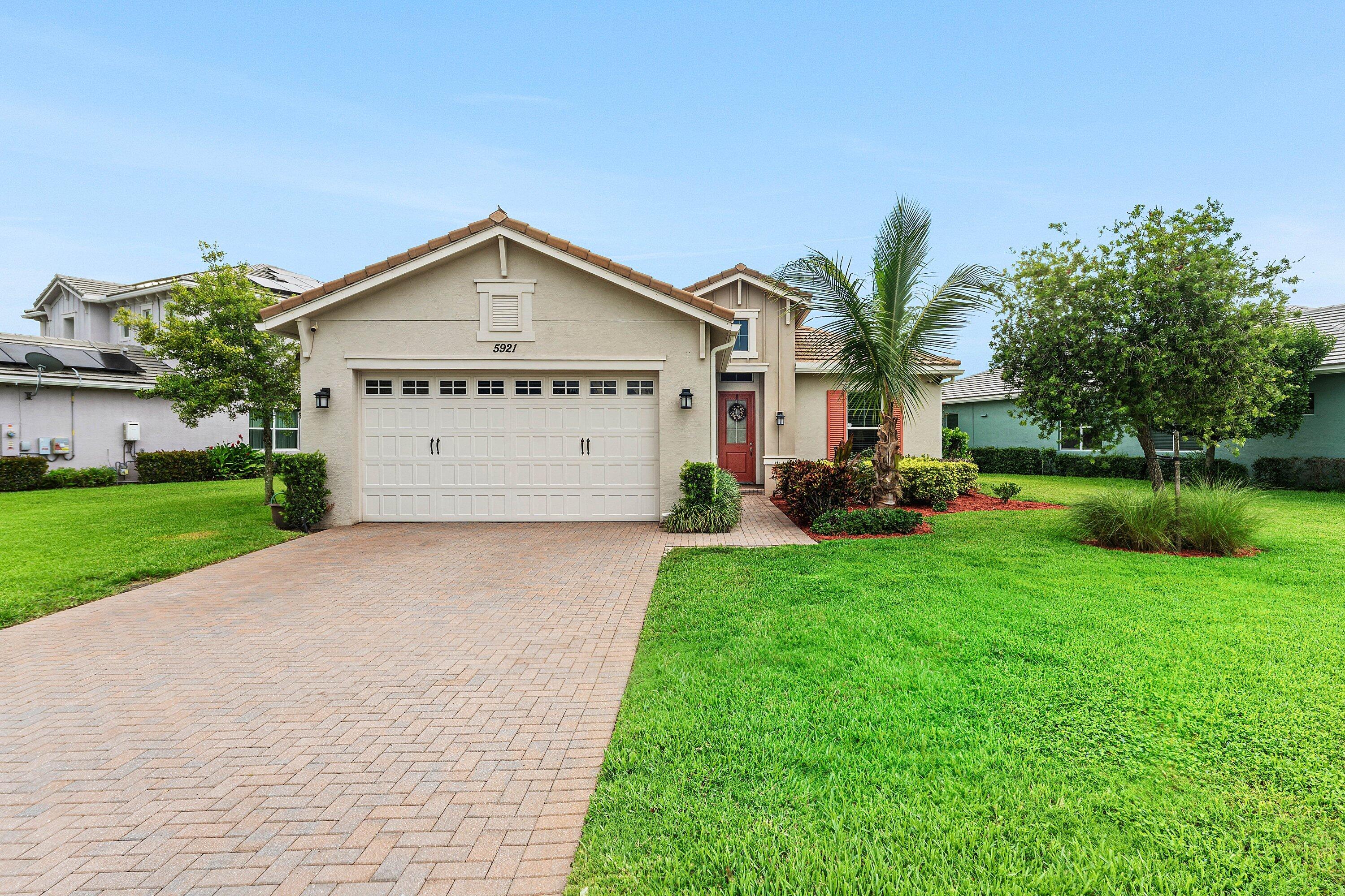 Stunning Lakefront Home with Resort-Style Amenities Don't miss this immaculate 3-bedroom, 2-bath home with breathtaking lake views and a spacious pie-shaped front yard. The open-concept kitchen features granite countertops, a breakfast bar, stainless steel appliances, and plenty of space to entertain. The luxurious master suite boasts tray ceilings, his-and-hers closets, double sinks, a linen closet, and a massive walk-in shower. Beautiful wood-look tile flooring flows seamlessly through the main living areas and bedrooms, adding warmth and style throughout. Located in a vibrant, resort-style community, residents enjoy access to an Aquatic Center, Lagoon-style family pool, basketball courts, a BMX pump park, dog park, Adventure Playground, concert pavilion, and so much more.