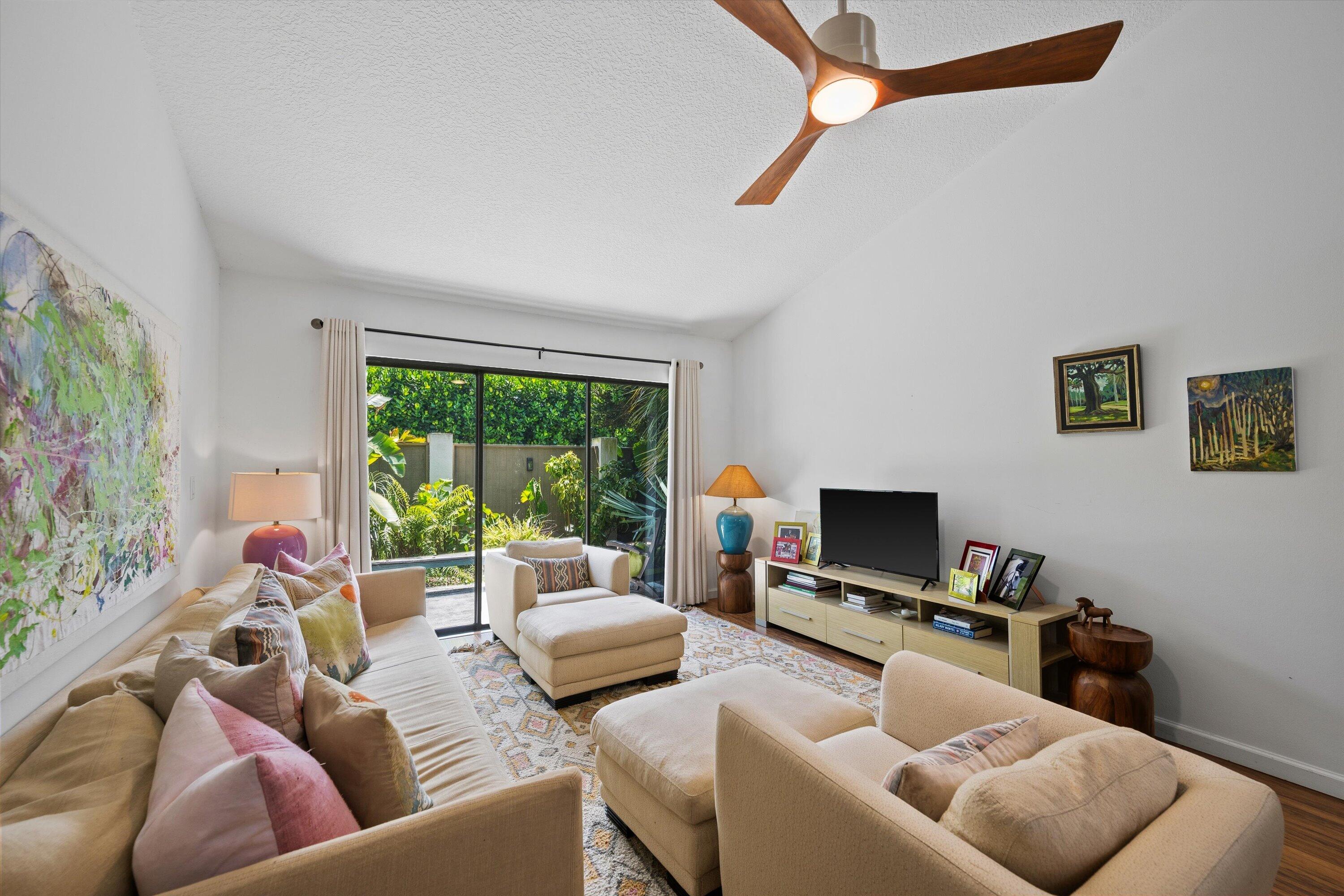 The best 2/2 in Wellington is available. Completely move in ready, this corner unit has natural light and 3 sliders to the back patio. High ceilings, updated baths and kitchen and front and rear patios, plus a 2 car garage. This house has everything.