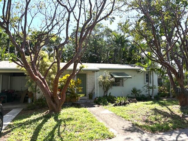 WOW! Great Location! Easy access to beaches, casino, Dania pointe shops, airport, I-95 & 595. Large Corner Lot fully fenced, 2 bed - 2 bath with carport, laundry room w/ full size W/D New Dryer and Hotwater heater. Newer A/c, Newer Roof, Freshly Painted Interior.  Bonus Sun/Family Rm. Ready to Move in! Spacious open floor plan. Lush tropical landscaping. Serious buyer's only owner is firm. See attached