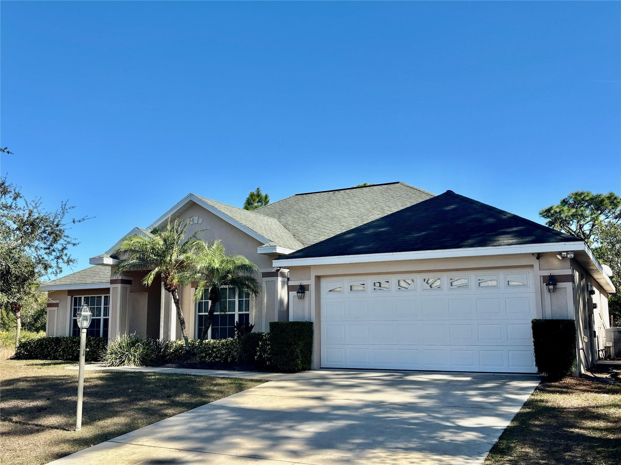 Motivated Seller! Seller is offering seller concessions. Stunning 2,465 total square foot home with 3 Bed/2 Bath in Placid Lakes on a double lot.  Cathedral ceilings with crown molding. Beautiful kitchen with stainless steel appliances and granite countertops with a large wraparound bar. Breakfast nook and a formal dining room. French doors open up to the huge family room. Large Master suite with magnificent master bath with double sinks, walk in shower and jacuzzi tub for relaxing! Two walk in closets in the master bath. Big two car garage. The home is conveniently located close to schools, Publix, Restaurants and the downtown area.  All Measurements are approximate.