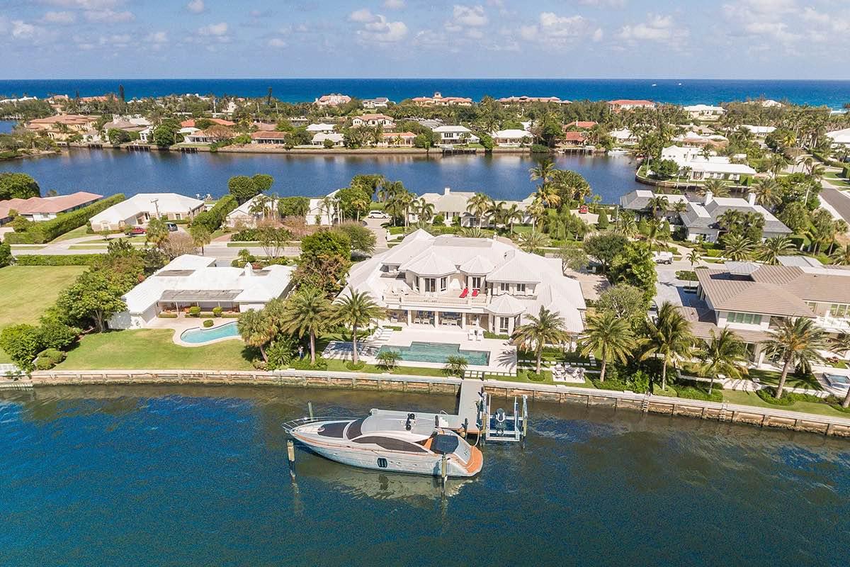 Experience stunning panoramic Intracoastal waterfront views from this expansive estate. Enter through the grand, light-filled two story foyer to discover direct water views, elegant architectural details and designer touches. The open and very spacious floor plan encourages the easy flow of conversation between the elegant living room and adjacent dining room. Each enjoy long water views across the Intracoastal. The sleek gourmet kitchen features a large central island with plenty of seating, state-of-the-art appliance and a lovely breakfast area. Marble flooring unites the main living areas.

On the second floor, sit back and take in the panoramic views from the 1,300 SF master suite with his and her baths, a freestanding bathtub, dressing areas and an expansive private terrace. Experience stunning panoramic Intracoastal waterfront views from this expansive estate. Enter through the grand, light-filled two story foyer to discover direct water views, elegant architectural details and designer touches. The open and very spacious floor plan encourages the easy flow of conversation between the elegant living room and adjacent dining room. Each enjoy long water views across the Intracoastal. The sleek gourmet kitchen features a large central island with plenty of seating, state-of-the-art appliance and a lovely breakfast area. Marble flooring unites the main living areas.

On the second floor, sit back and take in the panoramic views from the 1,300 SF master suite with his and her baths, a freestanding bathtub, dressing areas and an expansive private terrace. With a study, gym, and billiards room, you'll never have to leave home! 
The resort-like backyard is perfect for entertaining. The expansive covered lanai features coffered ceilings and infinity screens. Lounge areas by the sparkling heated pool and spa and a waterside fire pit beckon you to relax. A dock with a 14,000 lb boat lift completes this estate.  Includes gratis membership to the La Coquille Club at the EAU Palm Beach.