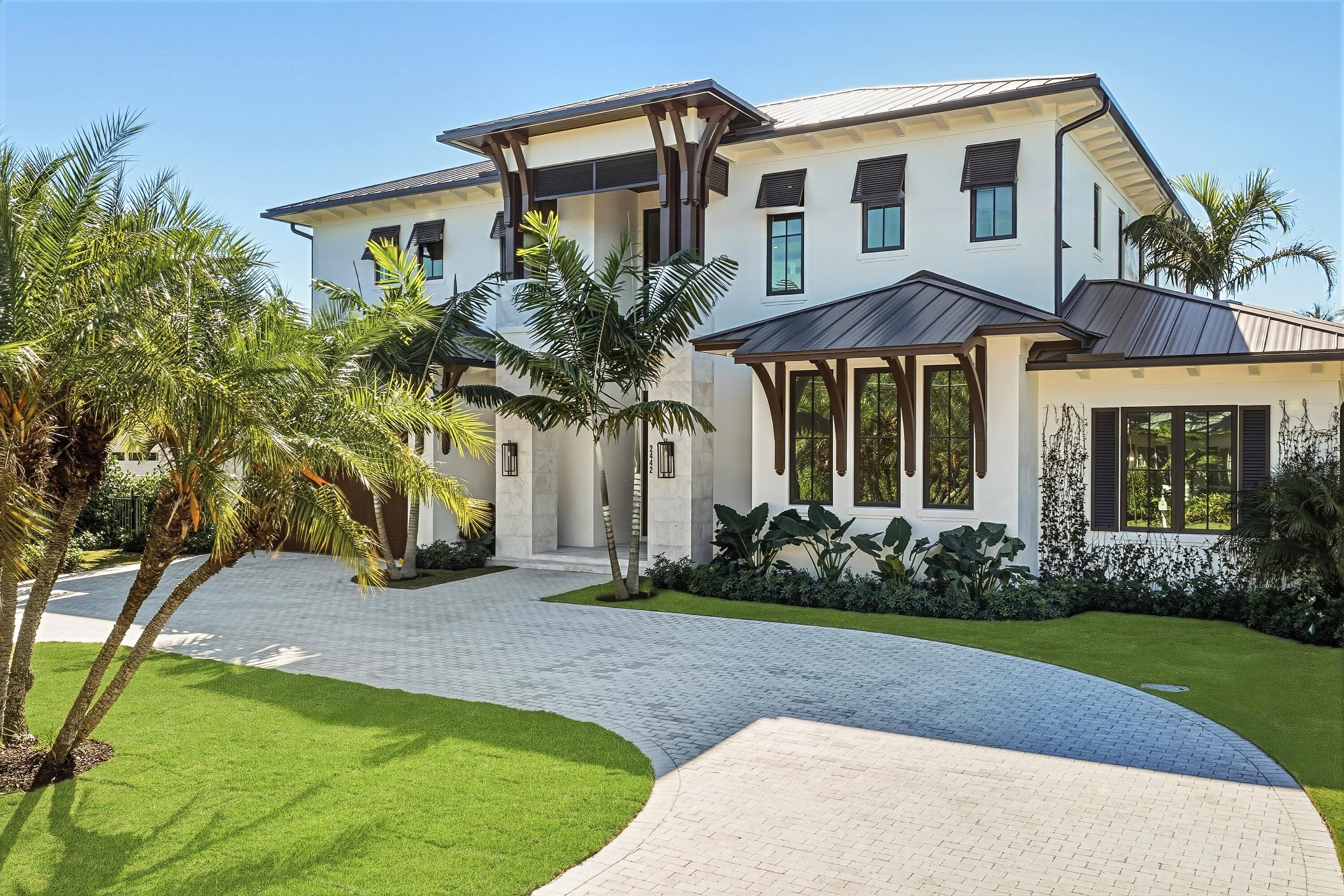 A rare expression of modern coastal luxury, this brand-new 2026 Foster Banyan estate sits on 71 feet of pristine waterfront with direct Intracoastal and ocean access--offering the ultimate South Florida boating lifestyle with no fixed bridges. Designed for both grand entertaining and everyday comfort, this CBS two-story residence blends architectural elegance with resort-style outdoor living. Custom solid mahogany double doors open to light-filled interiors featuring wide-plank white oak floors, stained beam accents, expansive picture windows, and pocket sliders that dissolve the boundary between indoors and out. The showpiece kitchen stuns with Bently Gold marble countertops and backsplash, a statement island, Thermador appliance suite, custom pantry/coffee station, and an adjoining wet bar with dual wine coolers and ice maker. The outdoor experience rivals a private resort--marble decking surrounds a heated salt- chlorinated infinity pool and spa, summer kitchen with built-in grill, lush tropical landscaping, new seawall, turf yard, and fully fenced grounds. The first-floor primary retreat offers its own foyer, morning bar, dual walk-ins, and spa bath with soaking tub and dual rain showers. Upstairs, guest suites, a VIP suite, and an oversized loft open to covered balconies with water views. With impact glass, surround sound, generator stub, tankless gas systems, 3 A/Cs, and smart pre- wiring throughout, 1,000 gallon propane tank, every detail reflects thoughtful luxury and timeless coastal sophistication.