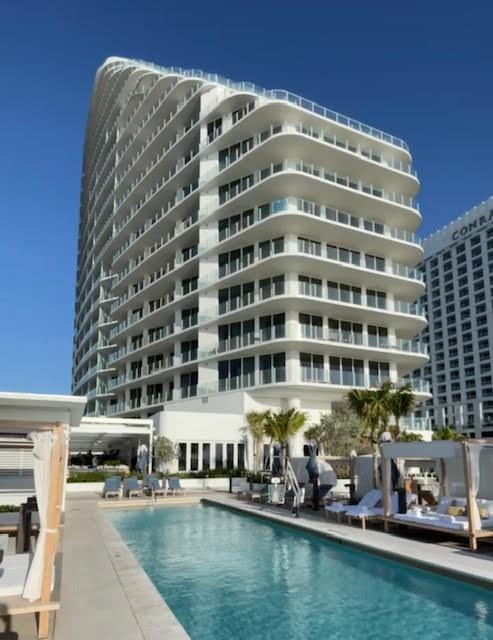 BRAND NEW FOUR SEASONS PRIVATE RESIDENCES, Eleventh floor, private residence with 3 bedroom, 3 1/2 bath and a southeastern exposure with direct ocean views. Dramatic floor to ceiling glass and gracious open terraces afford you ample natural light throughout the home. Gourmet kitchen with custom lacquered cabinetry, Dornbracht faucets, Sub Zero, Miele, and Wolf appliances. Dual owners retreat configuration optimizes privacy between you and your guests as well as offering a third full suite and additional half bath. Abundant closet space throughout this luxury residence. Baths are adorned with signature marble, custom oak cabinetry, and brushed nickel Waterworks fittings. The oversized terrace extends the entire width of this luxury residence with access from main living area and each suite.