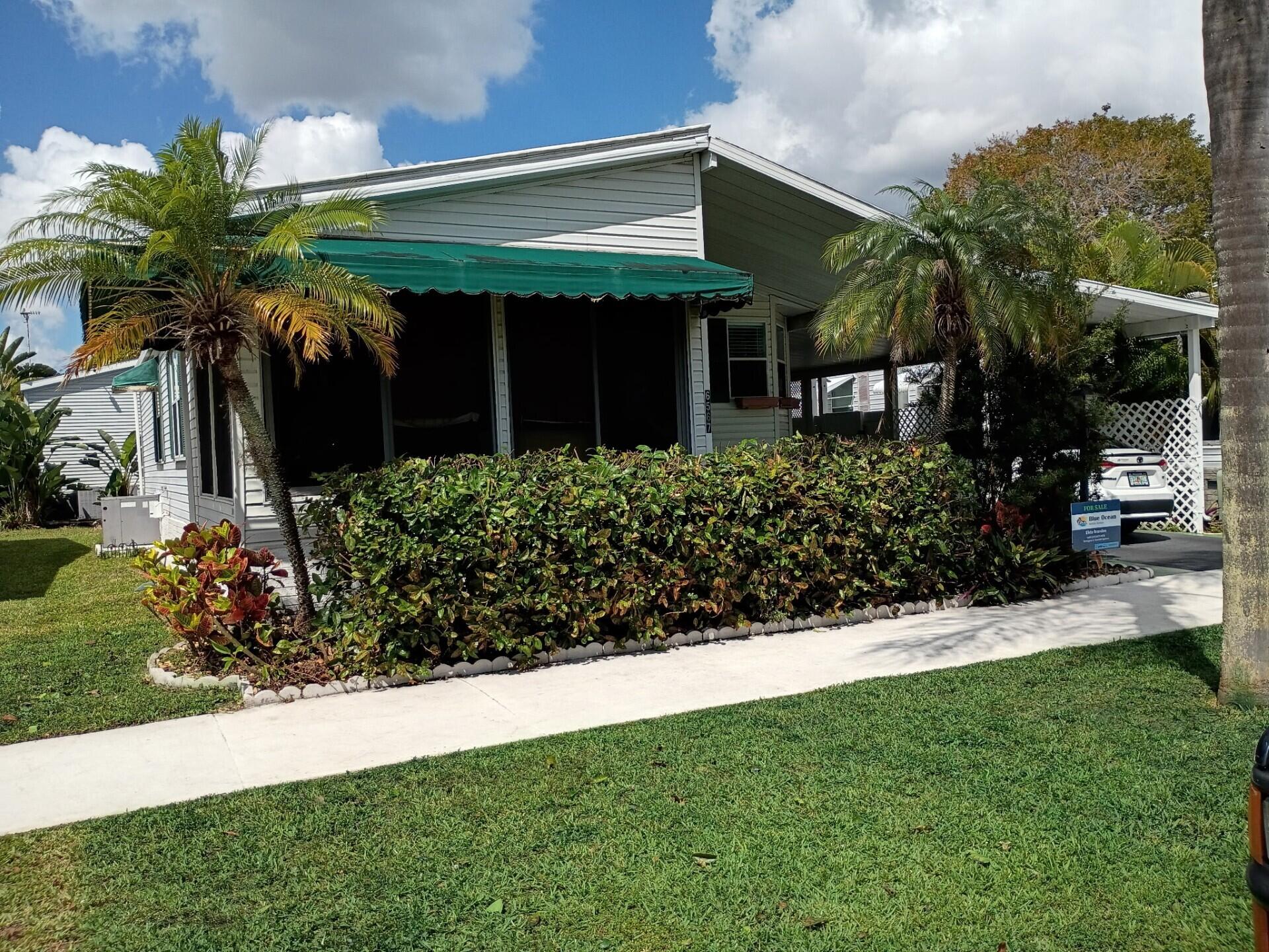 BEAUTIFUL HOME, WELL MAINTAINED WITH 2 BEDROOMS AND 2 BATH'S. CENTRAL AIR IS ONLY 6 YEARS OLD, WATER HEATER ABOUT 6 MONTHS OLD, STOVE,MICROWAVE AND LARGE SINK PURCHASED IN 2025. THIS HOME ALSO HAVE HURRACAINE WINDOWS AND SHUTTERS. LOCATED IN A 55+ COMMUNITY, ONLY A FEW MILES TO THE DESIRABLE BEACH OF DEERFIELD, THE WORRY-FREE SOUTH FLORIDA LIFESTYLE, WITH AMENITIES TO GALORE. CALL TODAY! IT WON'T LAST!!!  LOT RENTAL $1,015 MONTLHY.