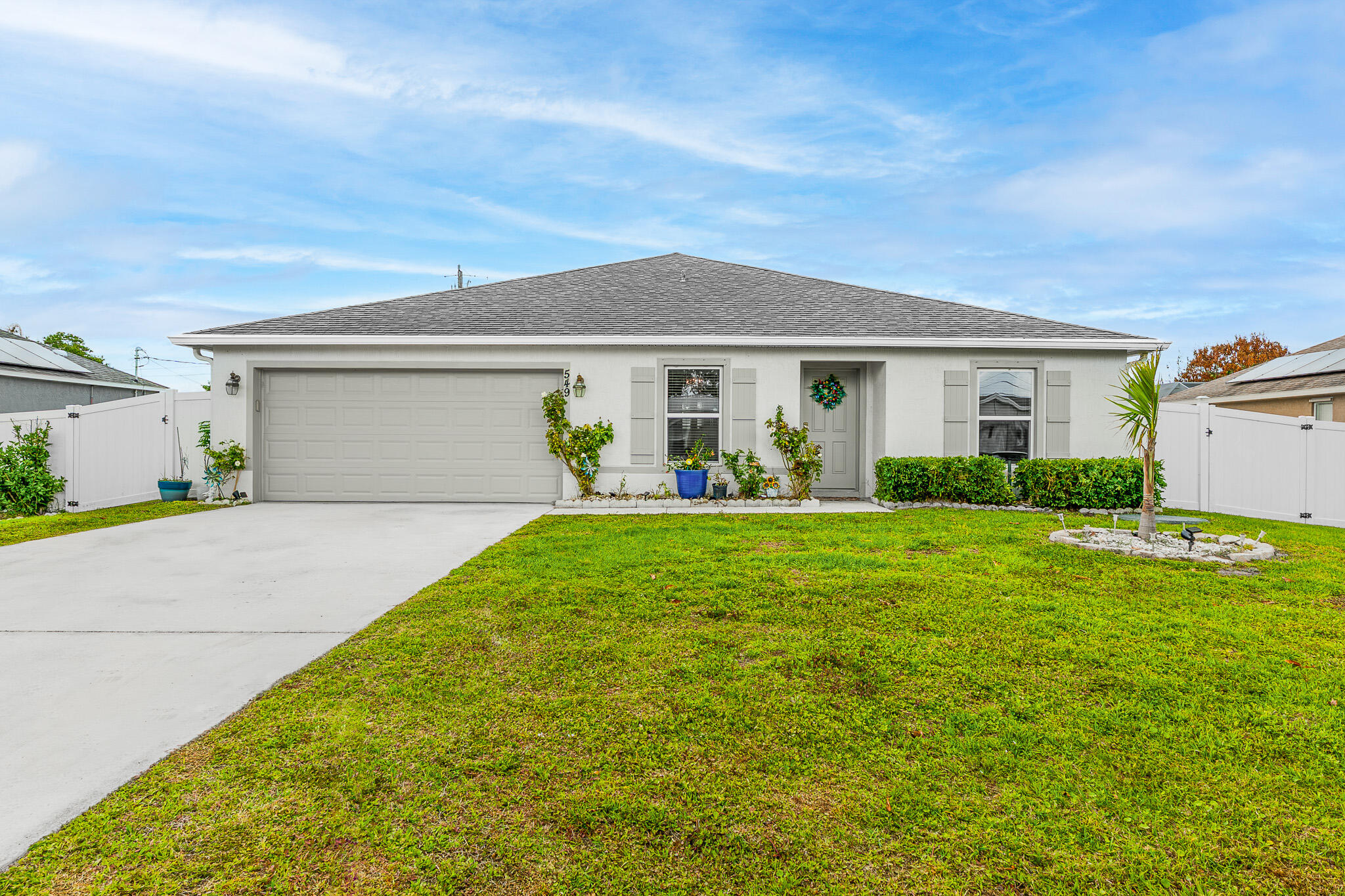 Let's Make a Deal/ Motivated Seller. Check Out This 2022 Built, 4 Bed, 2 Bath, 2 Car Garage Fully Fenced CBS Home. Bright Open Floor Plan with a Spacious Living Area, Modern Recessed Lighting, and Neutral Finishes Throughout. The Kitchen Offers Stainless Steel Appliances, Ample Cabinetry, and a Large Island Overlooking the Main Living Space. An Indoor Laundry Room, Waterproof Vinyl Flooring and Carpeting. Large Completely Fenced Backyard and Convenient Location: Situated in a Desirable Neighborhood of Port Saint Lucie, Close to St Lucie West, Crosstown, Mets Stadium, Turnpike, This Home Offers Easy Access to Shopping, Dining, Beaches, Parks, Schools, Hospitals and More! No Deed Restrictions or HOA! Call Today