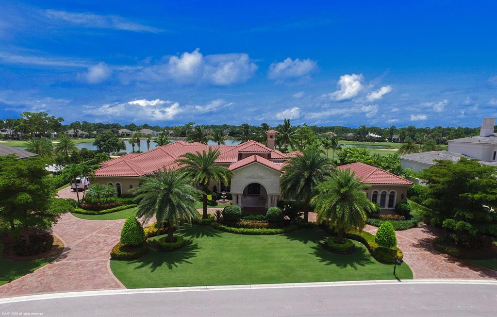 Luxury abound in this Custom Estate one acre residence with gorgeous golf view.  This home boasts stunning ceiling details, beautiful marble with inlays & hand scraped wood floors, handsome club/billiards room, 3 lavish powder rooms, a separate 2 bedroom guest house, state of the art theater room with comfy theater seating & 85'' screen, light and bright kitchen with double islands, Thermador appliances, large walk in pantry and butler pantry.  The private dining room is perfect for hosting a dinner party and includes a butler serving area.  Relax in the owner's retreat featuring a morning bar, sitting area, bonus room (perfect for an office or exercise area), expansive walk in closets, exquisite master bathroom w/ whirlpool tub, his & her sinks and a makeup vanity.  The backyard is a tropical oasis featuring a large covered lanai, summer kitchen with built in bbq, custom heated pool and spa with stunning rock water feature, remarkable golf and lake view.  Make this incredible estate home yours today!