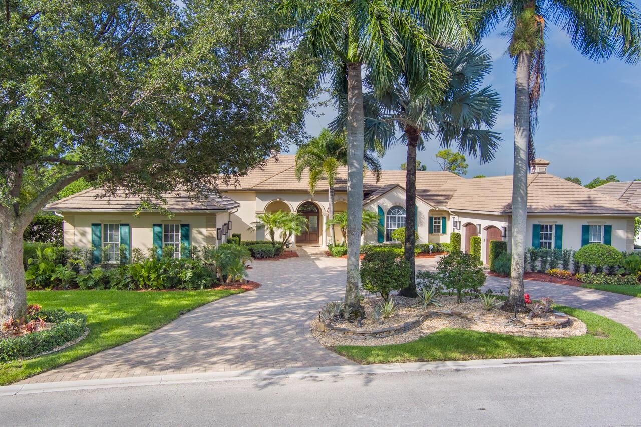 Exquisite home in the Medalist. BEST LOT in the community. 4 bedrm/6.5baths/ 4 car garage. Spacious-nearly 5,000 sq ft living area & 7700 sq ft total. Resort Style pool/spa. Expansive Loggia with retractable screening, fireplace, & summer kitchen  & new $8,000 grill. Cabana Bath. Beautiful views of lake & golf course. Expansive Master Suite offering his & her baths & walk in closets. Stunning Office with built-ins. Entrance overlooks the Living Rm & fireplace adjoins the Formal Dining Rm-new wood flooring. Wine Rm.  Expansive Kitchen overlooks the Family Rm & Breakfast Nook. Four Ensuite Bedrooms. 4th garage recently added. A/C in garages. Well for irrigation. 50KW whole house generator & 1,000-gallon owned gas tank. Exquisite woodworking! Car lift available. 2 new 80 gal hot water heater
