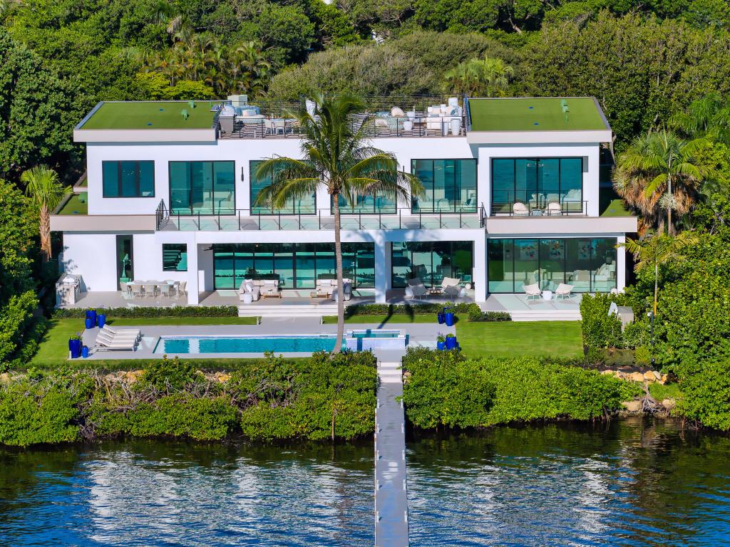 Welcome to 1422 SE Atlantic Drive, a rare opportunity to own one of the most prestigious newly completed waterfront residences directly across the water from Manalapan. Crafted by the renowned Joe Farrell of Farrell Building Company, one of the nation's leading ultra-luxury home builders covering the Hamptons and the Palm Beaches, this stunning estate epitomizes modern elegance and South Florida living at its finest. Set on a sprawling half-acre parcel with 120 feet of direct waterfront, the home offers breathtaking views of the Intracoastal Waterway and some of the world's most iconic estates, including the celebrated Manalapan Ocean-to-Lake properties. Encompassing over 7,800 square feet of exquisitely designed living space, this estate features soaring 10-foot ceilings on both levels, creating an atmosphere of refined grandeur and light-filled openness. On the third level, you'll find an epic rooftop with iconic water views.

The home boasts seven expansive bedrooms and eight impeccably appointed bathrooms, each designed with both luxury and functionality in mind. In particular, the dual option for both upstairs and ground floor primary suites, both with exceptional water views, provides extensive versatility. Every inch of this estate showcases signature craftsmanship combining timeless architectural detail with state-of-the-art technology and innovative design. From the chef's gourmet kitchen to the elegant indoor and outdoor living spaces, every feature has been meticulously curated for elevated living and effortless entertaining. The estate also includes a spacious multi-vehicle garage, ideal for car collectors or boating enthusiasts. With direct access to premier boating waters, this waterfront sanctuary has a 250 foot dock and is perfectly suited for yachting, water sports, or simply enjoying South Florida's stunning coastal lifestyle.

This exceptional home is fully furnished and move-in ready, offering an unmatched opportunity to own a true masterpiece in one of South Florida's most sought-after locations.

DISCLAIMER: Information published or otherwise provided by the listing company and its representatives including but not limited to prices, measurements, square footages, lot sizes, calculations, statistics, and videos are deemed reliable but are not guaranteed and are subject to errors, omissions or changes without notice. All such information should be independently verified by any prospective purchaser or seller. Parties should perform their own due diligence to verify such information prior to a sale or listing. Listing company expressly disclaims any warranty or representation regarding such information. Prices published are either list price, sold price, and/or last asking price. The listing company participates in the Multiple Listing Service and IDX. The properties published as listed and sold are not necessarily exclusive to listing company and may be listed or have sold with other members of the Multiple Listing Service. Transactions where listing company represented both buyers and sellers are calculated as two sales. "No payments made until title passes" Some affiliations may not be applicable to certain geographic areas. If your property is currently listed with another broker, please disregard any solicitation for services. Information published or otherwise provided by seller, listing company or its representatives is deemed reliable but are not guaranteed and subject to errors, omissions, or changes without notice. Copyright 2026 by the listing company. All Rights Reserved.