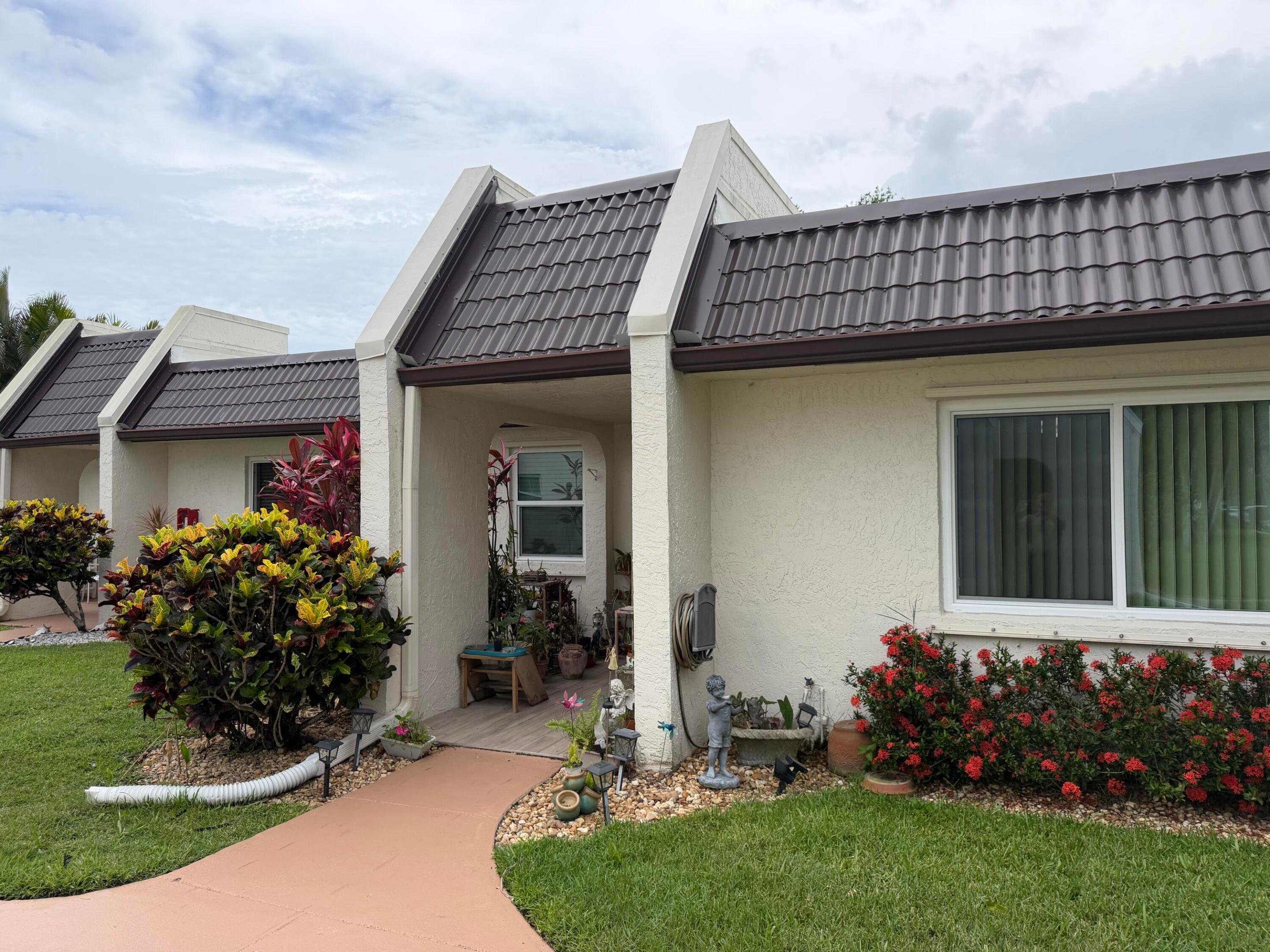 55 plus PRIME location, first floor with the view of an expansive canal and wildlife with a very large greenspace directly behind the home. One of few units with full size washer and dryer hookups.  Enjoy the screened in patio with new fans and water view.   Upgraded hurricane impact windows throughout including the slider to the patio plus a metal roof . Upgraded kitchen with hardwood cabinetry and granite countertops.   5 star tile throughout the living area with the ultra modern wood plank look.  Updated vanity in the master bathroom.   Golden lakes in a perfect central location near resaurants and shopping with a manned gate, pools, a clubhouse, card room, sauna's, a tiki bar, onsite cafe and more!