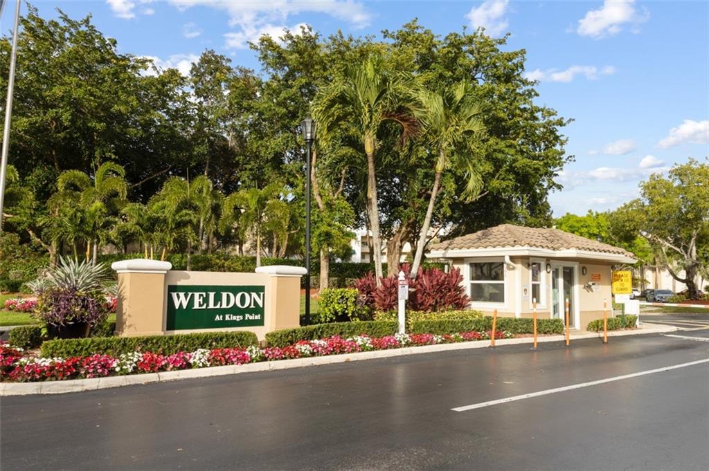 Beautiful and Move-in ready, Large 2 bedroom 2 bath  in the sought-after gated community Weldon located in Tamarac. This FIRST FLOOR UNIT features Reserved parking just footsteps from your front door. Accordion Hurricane Shutters, Open Floor Plan with lots of natural light, Amazing tranquil view of water and fountains from your living room and master bedroom. Weldon amenities are the envy of Kings Point. One of the best-kept 55+ communities, including numerous clubhouse activities, movie theatre shows including live entertainment, indoor and outdoor swimming pools, and recreations from tennis to billiard rooms.