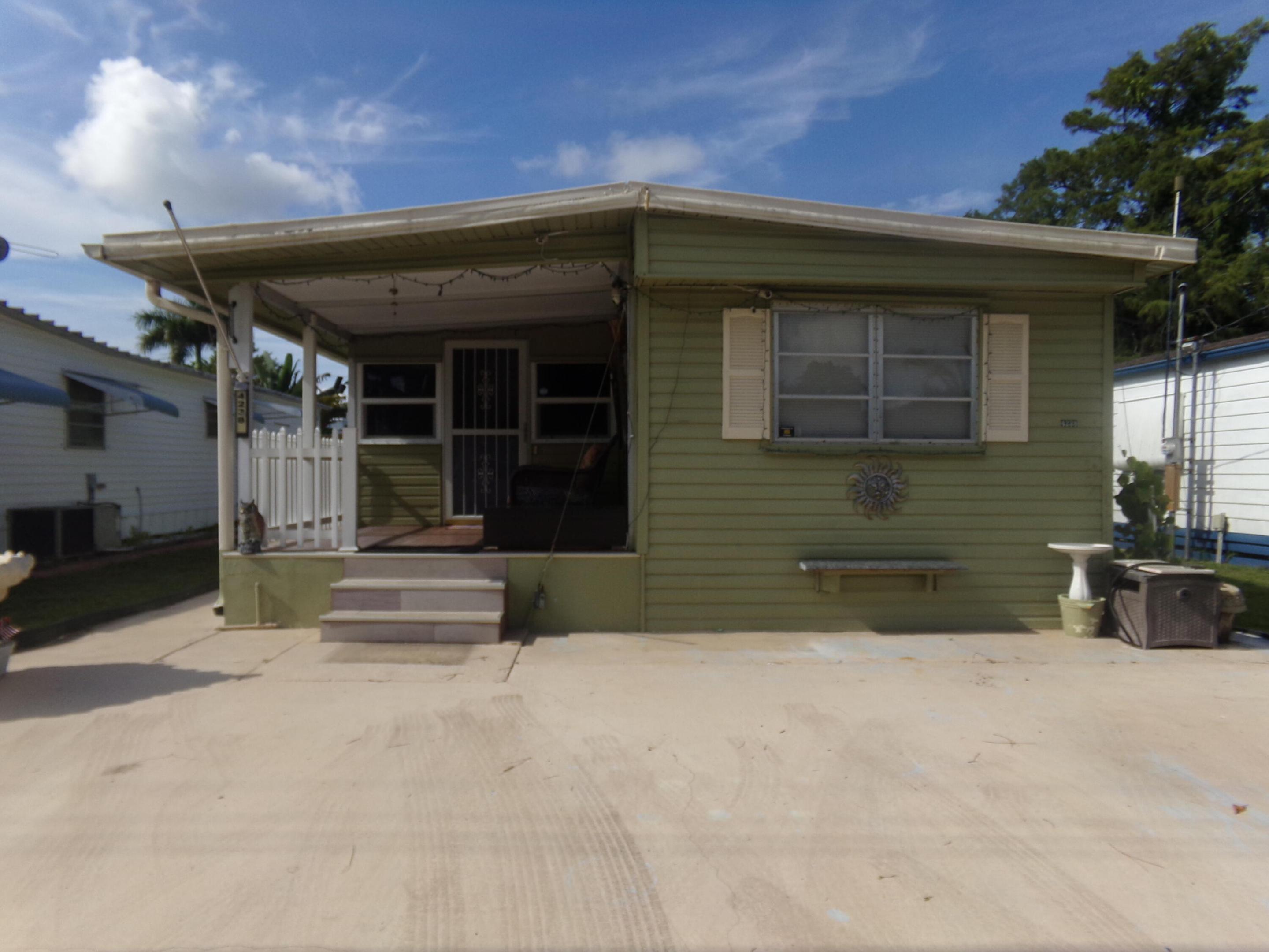 Welcome to this charming 2-bedroom, 2-bathroom mobile home located in Parry Trailer Village in Boynton Beach, FL. Offering over 872 square feet of comfortable living space across a single story, this property provides an efficient and practical layout ideal for those seeking a streamlined residence. The two full bathrooms add convenience to daily living, while the thoughtfully designed floor plan maximizes usable space. back room can be utilized as a home office or hobby room. Situated in an established community, this home presents an accessible option for buyers looking for straightforward, affordable living in Boynton Beach. A/C is brand new. One of the Lowest HOAs in the area and low taxes. You own the land!
