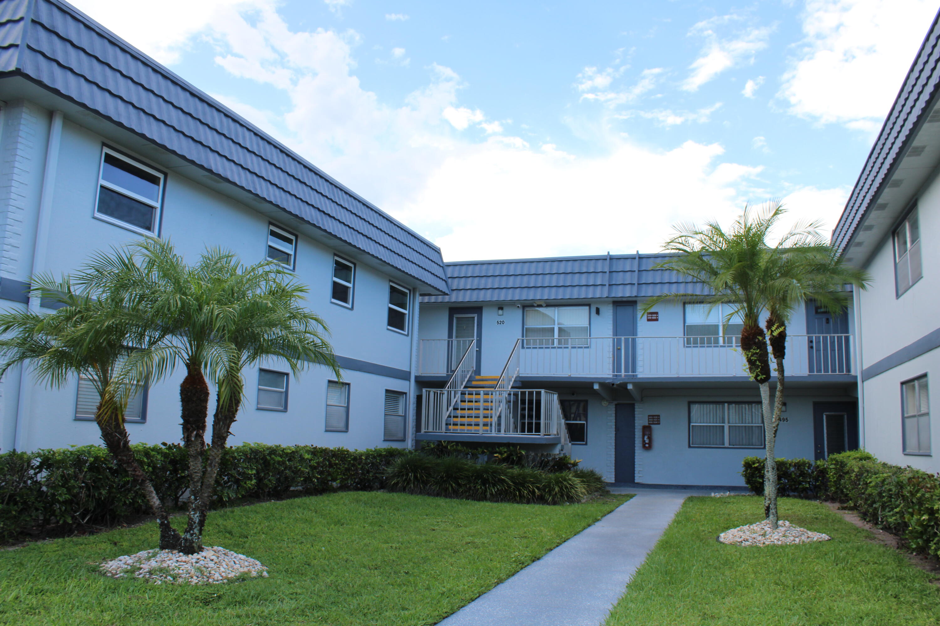 Welcome to this move-in ready 2BR/2BA corner unit in the highly desirable, guard-gated Kings Point 55+ community.   AVAILABLE for September 1 for annual rental.   Enjoy ultimate privacy in this bright, upstairs condo featuring excellent natural light, clean carpeting, and a covered back patio complete with a private washer/dryer. Assigned parking is just steps from your entrance. Available fully furnished or unfurnished to suit your needs!  Live the resort lifestyle with access to a newly renovated multi-million dollar clubhouse, expansive fitness center, indoor/outdoor pools, a theater, and pay-per-play golf.  55+ community. Support animals must apply. 1 assigned spot + guest parking.