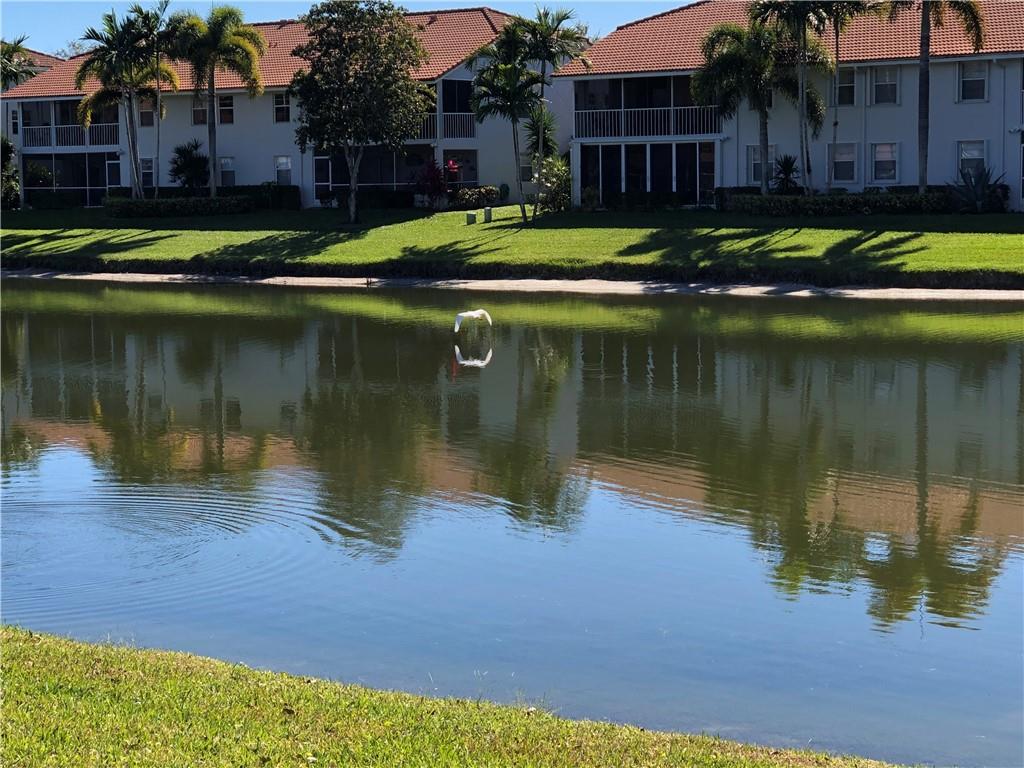 Relax and enjoy the park like setting of this lovely villa, with picturesque lake views from the Florida room and lanai! Imagine yourself reading a book while sipping your morning coffee and watching the birds fly over the mirror-like lake. Then later in the day, enjoy a refreshing beverage of your choice and watch the sunset! This gated 55+ community provides plenty of activities in a resort style atmosphere. No neighbors in front and just a short walk to a satellite pool. Soaring ceilings in the main living area, spacious primary bedroom suite with walk-in closet, split bedroom floor-plan provides nice privacy for guests. Desirable location close to shopping, restaurants and medical offices.