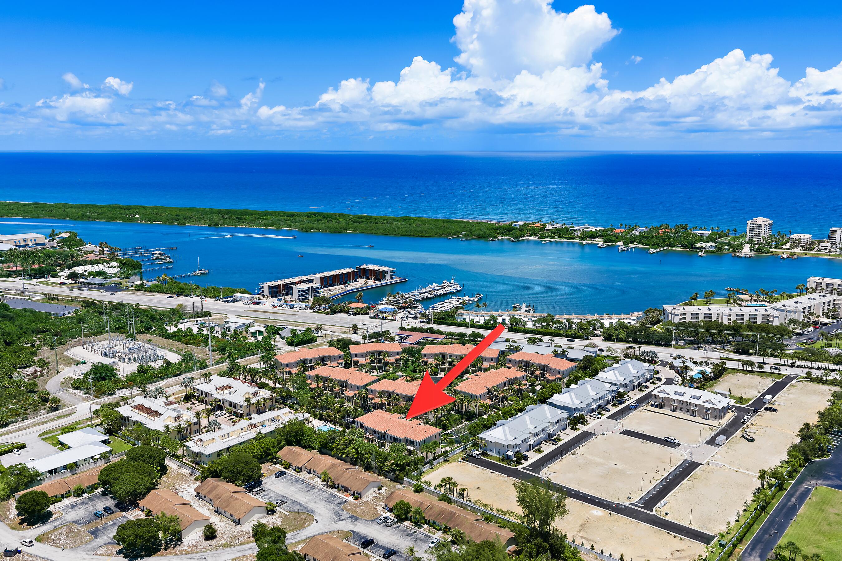 Tucked within a small, gated community in the heart of Tequesta, this impeccably maintained three-story luxury townhome offers just under 2,900 square feet of thoughtfully designed living space, complete with a private elevator for effortless access to all levels—perfect for those who want the space of a multi-story home without the inconvenience of stairs.  As an end unit, the home is filled with natural light and features soaring 11-foot ceilings and an open-concept layout that creates a spacious  feel from the moment you arrive. Since purchasing the home, the owner has completed an extensive list of meaningful upgrades, including a 2026 A.O. Smith hot water heater, 2025 HVAC system, new LG refrigerator and dishwasher, Newair 15-inch built-in wine refrigerator, new thermostat,  updated kitchen sink and faucet,  and all new door hardware throughout.  The entire interior has been freshly painted, including the walls, ceilings, casings, baseboards, garage, and exterior garage door, while oversized 60x30 porcelain tile flooring was installed on the second floor and the stair carpeting was replaced for a cleaner, more modern look. An additional custom storage closet was also added in the garage—an upgrade unique to this property.  Beyond the cosmetic improvements, the home has been thoughtfully enhanced with high-quality behind-the-scenes upgrades that elevate both convenience and functionality. A user-friendly smart home system controls LED lighting throughout the residence, offering customizable colors and operation by app or wall switch. The owner also replaced outlets, switches, and GFIs throughout the home, and installed motorized blackout blinds in the primary bedroom for added comfort and privacy.  Designed for both everyday living and entertaining, the main living area opens to a private balcony overlooking a peaceful preserve, while the spacious primary suite enjoys its own balcony retreat.  Residents enjoy a clubhouse, fitness equipment, and community pool, all within this intimate, tight-knit neighborhood located just moments from the turquoise waters of the Intracoastal, waterfront dining, marinas, and everything that makes Tequesta one of South Florida's most sought-after coastal communities.