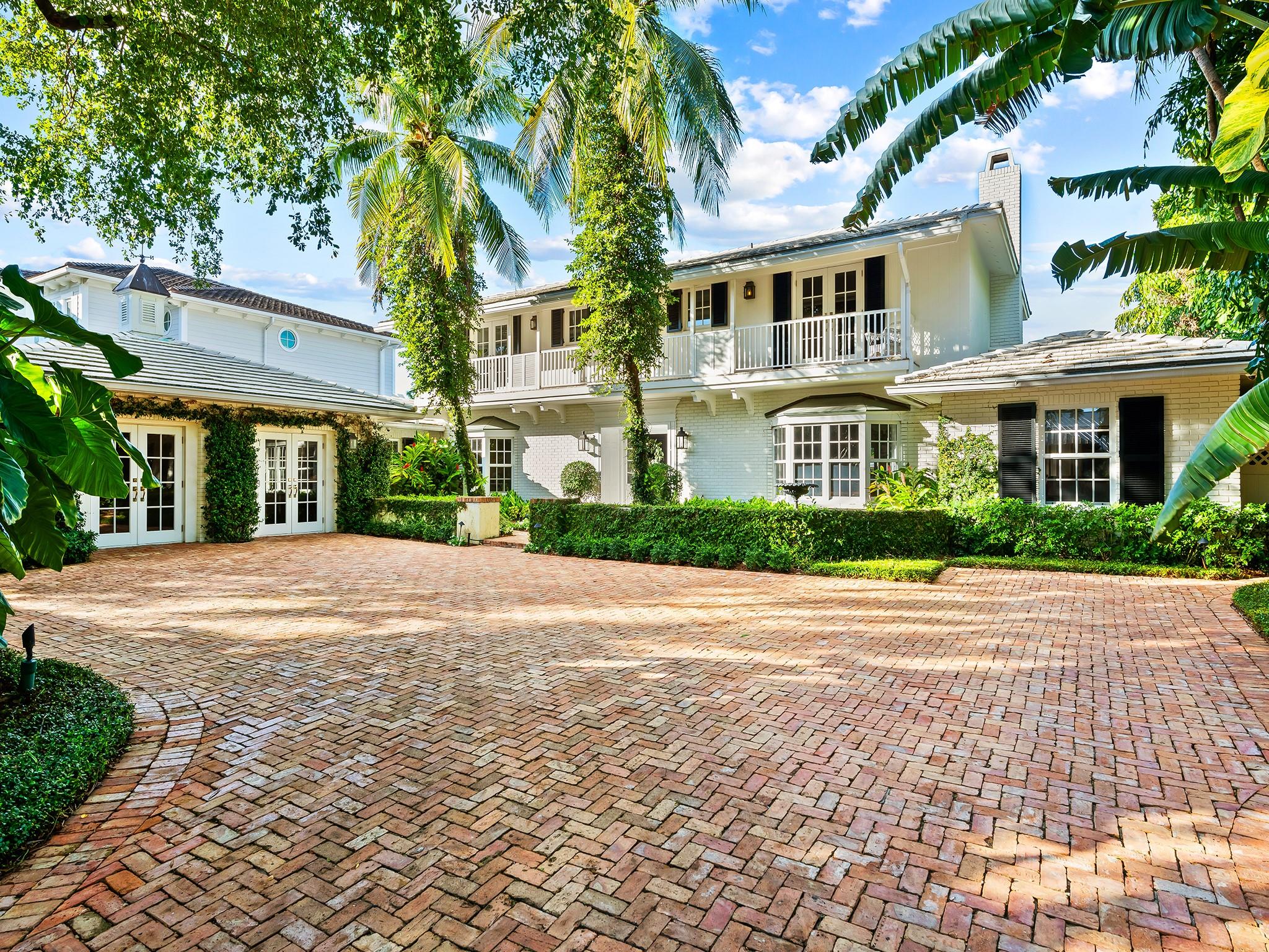 Elegant Palm Beach Style, Classic Island, waterfront colonial home in the HEART of Rio Vista. This gated property with 100 year old trees, lush landscape, paired with natural gas lanterns and old Chicago Brick courtyard boasts amazing charm and character. Thirteen sets of French doors lead you to the impeccably designed pool and hot tub. This stunning home has natural Walnut floors, high ceilings with extensive woodwork and a wood burning fireplace. Completely renovated in 2018 with eat in kitchen, viking gas stove, formal dining, his and her offices on first floor and tons of living space throughout. Garage converted family room, 3 bedrooms upstairs plus a master closet that can be converted to a 4th bedroom and a guest room on the first floor. Truly a spectacular Classic.