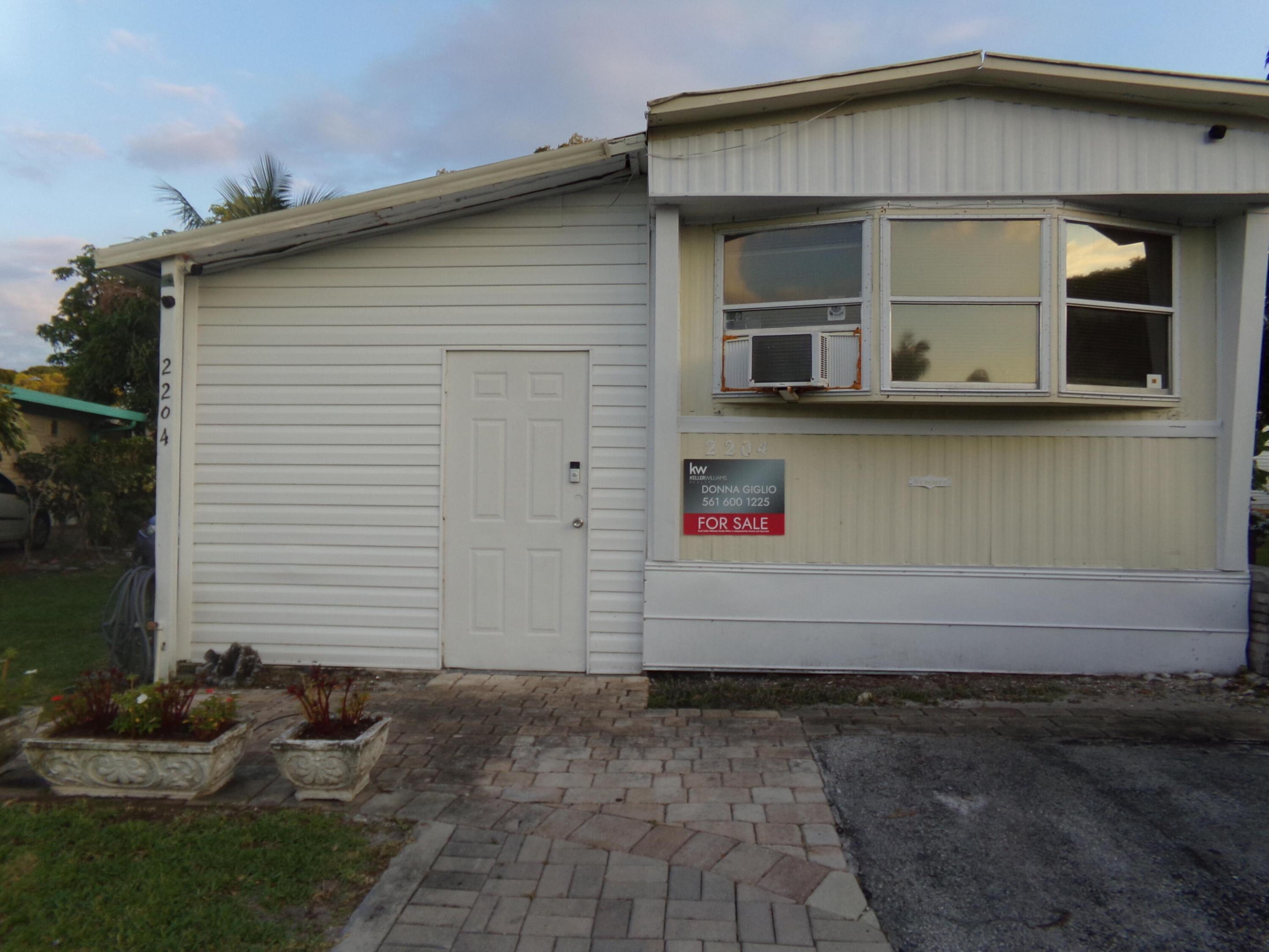 Motivated seller. Endless Potential near the coast! Welcome to Sand and Sea Village, a vibrant Boynton Beach community just minutes from the Atlantic ocean and pristine beaches This 3 bedroom , 2.5 bathroom home offers a rare amount of space for the sq. footage and a great footprint , just waiting to be restored  to its full glory.it needs some TLC and is priced accordingly. Private entrance to one of the bedrooms allows for guest privacy. Home is situated on an oversized peaceful lot with privacy. Nice size shed for extra storage. Don't miss out on owning a piece of South Florida at a great price. Bring all offers.