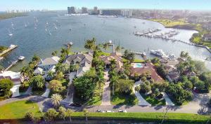 Rare opportunity to live the Northern Palm Beach Lifestyle with your yacht! Masterfully built home with one of a kind breathtaking view of direct Intracoastal in the exclusive community of Portage Landing South. The spectacular view and vast openness of the water along with the thoughtfully and tastefully appointed architectural details throughout (including first class fixtures and finishes) are what make this home so unique and desirable.   It is located in a gated private enclave on just over 1 acre of land and water with 133' of water frontage availing a beautiful southern exposure to the Intracoastal, no fixed bridges and direct ocean access.  Your experience begins driving up the long pavered drive framed by 8 mature Royal Palm trees.