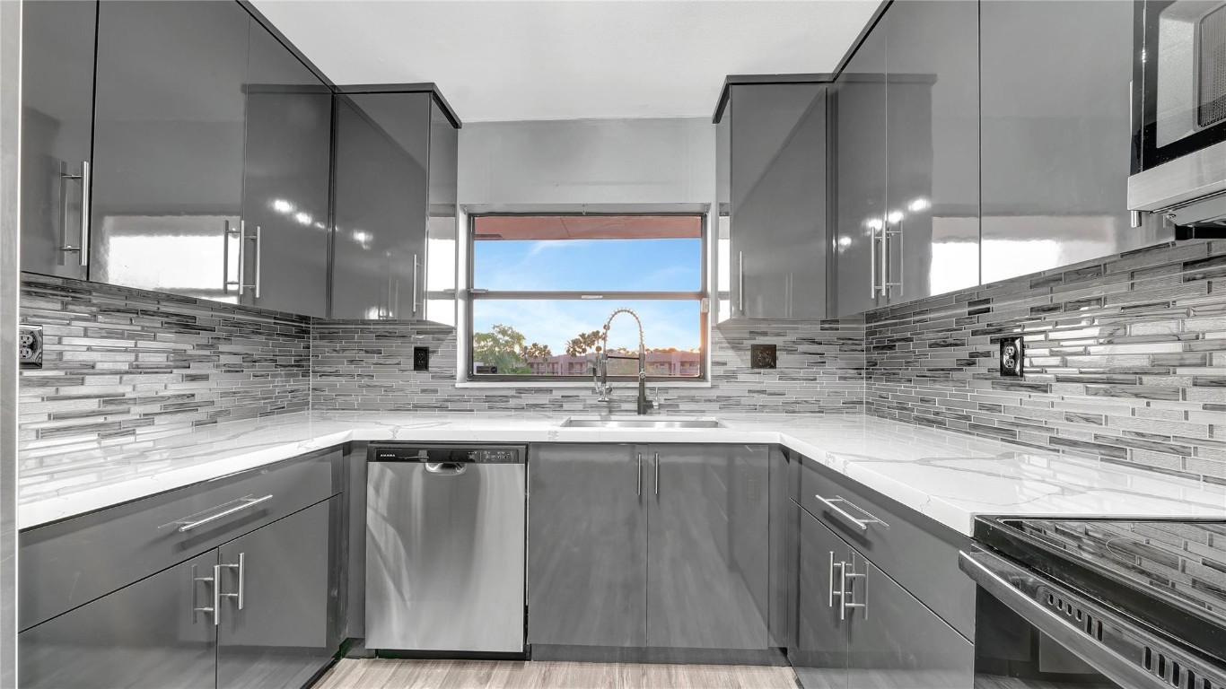 Price Just Reduced! Look No Further! This fully renovated unit located on the 4th floor of Phase 4 is the perfect home for you! Features include brand new kitchen with brand-new stainless-steel appliances, brand new quartz calacatta classic countertops, both bathrooms fully renovated, all new floors throughout, brand new A/C and water heater, beautiful view of the water and golf course, screened in patio, amazing amenities. Close to restaurants, shopping, major highways, etc.