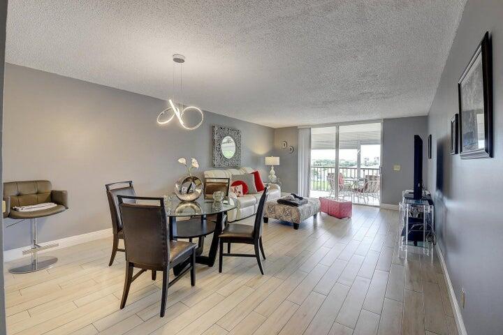 Light and bright, top floor two bedroom and two bath condo in elevator building. Enjoy relaxing water & fountain views from the screened patio. All tiled throughout, with eat in kitchen, updated cabinets & countertops. Huge walk-in closet & full bathroom with stall shower in the primary suite. Washer and dryer in unit! Deauville boasts a recently renovated & completed clubhouse with exercise room, theatre, pool and lots more. Walk to shopping, McDonalds, Duncan Donuts, Restaurants & more.15-20 minutes drive to the beach and trendy downtown Delray Beach.