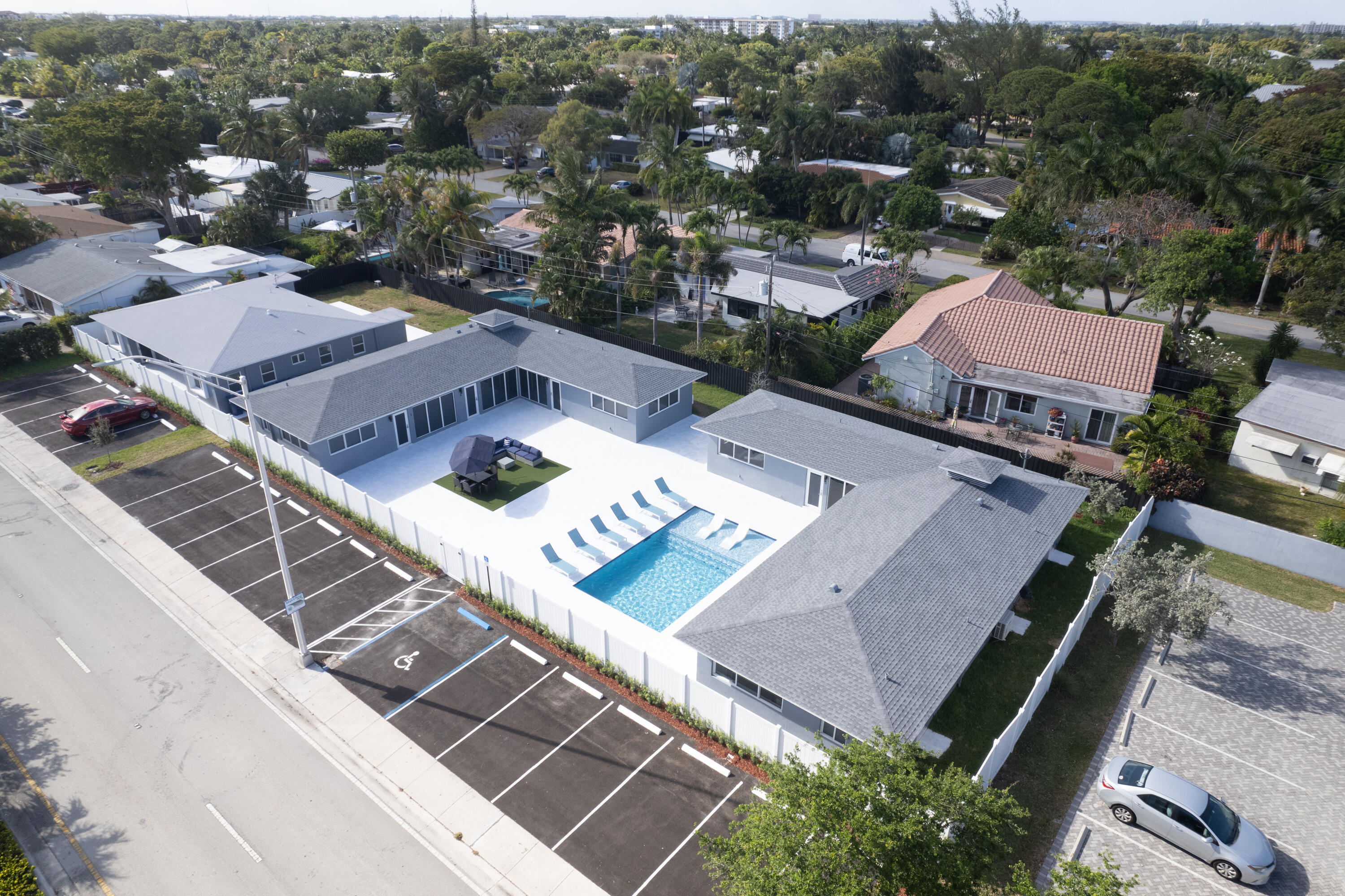 Thriving Airbnb Multi Family Compound in Wilton Manors. The portfolio consists of three consecutive buildings across three separate folios (additional MLS# B26007551 and B26007052), on an expansive ±21,000 sqft for a total offering price of $3,900,000. Unit count: 6 one-bedroom units, 2 studios, & 2 efficiencies, offering a highly desirable rental profile. All units are turn key & fully operational, resulting in a stabilized asset with immediate cash flow. Over $1M in renovations: new roof, electrical, plumbing, impact windows, plus a gorgeous Resort-style pool & 20-spot parking. Strategically positioned on a high-demand corridor, its proximity to Lauderdale Beach, Las Olas, Wilton Drive and International Airports supports year-round demand and repeat bookings. Seller Financing available.