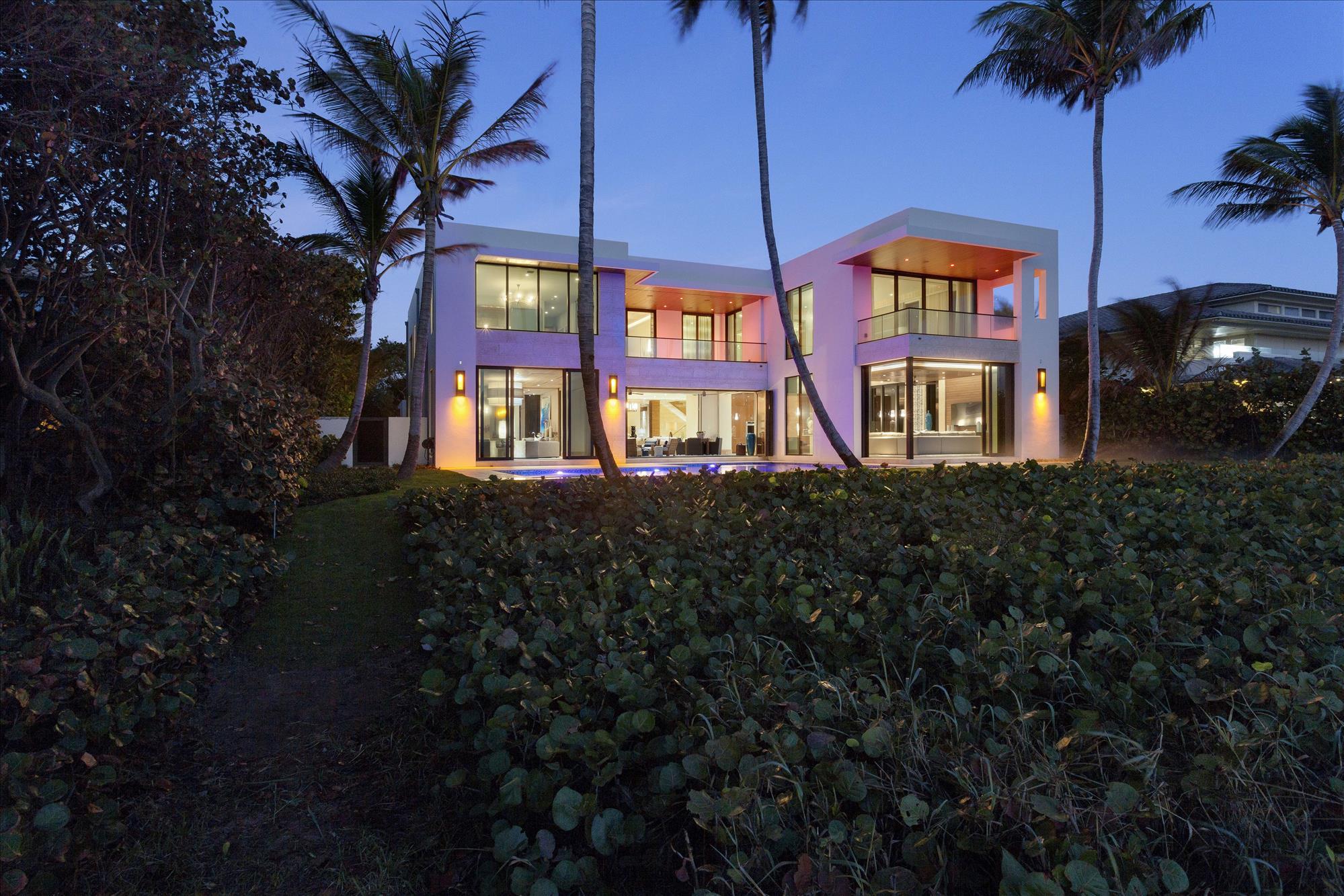 Idyllic ocean views provide the backdrop for this new ultra-modern masterwork secluded on sweeping grounds fronting 100± feet on the Atlantic Ocean and 103± feet on the Intracoastal Waterway equipped with a yacht dock.  The gated drive leads to two two-bay garages that frame the courtyard entry, with an ipe walkway across the reflecting pond.  Glass walls across the ocean side of the house bring the outdoors in and open by the shell-stone terrace around the immense resort-style pool with glass-bead-finish spa.  A pathway meanders over the seagrape-cloaked dunes to the sugar-sand beach.

The information herein is believed to be accurate but is not guaranteed and may be subject to errors or omissions, and may be changed without notice.  All measurements are approximate. Disclaimer: The information provided herein including but not limited to measurements, square footages, lot sizes, calculations and statistics have been obtained and conveyed from third parties such as the applicable Multiple Listing Service, public records as well as other sources. All information including that produced by the Sellers or Listing Company are subject to errors, omissions or changes without notice and should be independently verified by any prospect for the purchase of a Property.  The Sellers and Listing Company expressly disclaim any warranty or representation regarding all enclosed information.  Prospects' use of any information herein is acknowledgement of this disclaimer and that Prospect shall perform their own due diligence.  Prospects shall not rely on this information when entering into a contract for sale and purchase.  Some affiliations may not be applicable to certain geographic areas. If your property is currently listed, please do not consider this a solicitation.   In the event a Buyer defaults, no commission will be paid to either Broker on the Deposits retained by the Seller. "No Commissions Paid until Title Passes."    Buyer pays title insurance, Florida documentary stamps, and all other closing costs for New Construction and land use. Copyright 2016 Listing Company.  All Rights Reserved.