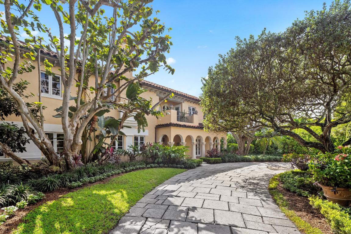 Fabulous, In-Town Mediterranean compound on the Ocean Block of Brazilian Avenue. With 8BR/8.2BA, this gorgeous estate features well-scaled rooms, great bones, and sun-filled interiors. The home features a rich blend of original charm and thoughtful updates. Beautiful pecky cypress ceilings, arched doorways, and decorative millwork throughout. Situated on the South Side of the street on a 17,120+/- square foot lot offering exceptional privacy with lush tropical landscaping. Gourmet eat-in kitchen with large island and top-of-the-line appliances leads to formal dining room. Adjacent breakfast room features arched French doors with views of the garden. Formal living room with gorgeous, beamed ceilings and fireplace. Expansive Primary Wing complete with office, dressing area, large bath with dual sinks, and multiple fireplaces. Numerous spacious guest suites with en-suite bathrooms. Beautiful 2BR/2BA guest house includes stunning wet bar and living room with accordion doors for seamless indoor-outdoor living. Resort-style exteriors include columned covered loggia, serene courtyards, spa, and large swimming pool.