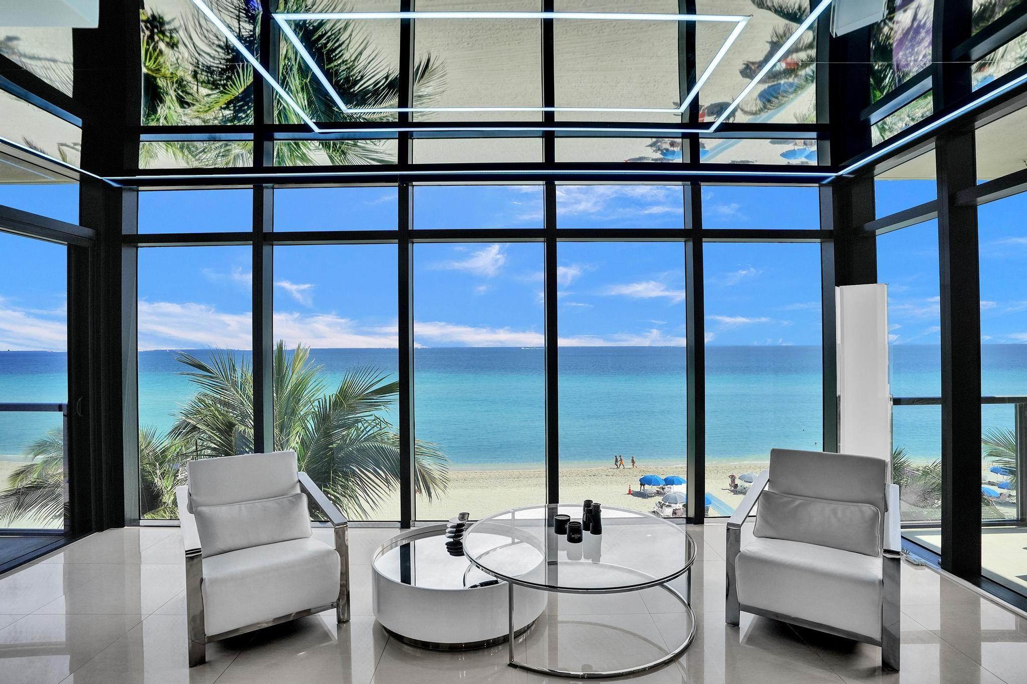 Step into this exclusive Oceanfront Penthouse in the luxurious boutique building, Sage Beach. Featuring its own large, spectacular rooftop terrace with a plunge pool, summer kitchen, and built-in BBQ—perfect for entertaining while enjoying stunning sunsets and ocean views, this penthouse offers the ultimate in coastal living. Enter through your private elevator to discover a sprawling 2,669 sq. ft. open floor plan. The unit features a spacious oceanfront master suite, two generous bedrooms with en-suite bathrooms, three balconies, a chef’s kitchen with top-tier appliances, custom finishes, a home theater projector, and more. The building offers a fitness center, heated saltwater pool, and private beach access. The unit comes with two parking spaces.