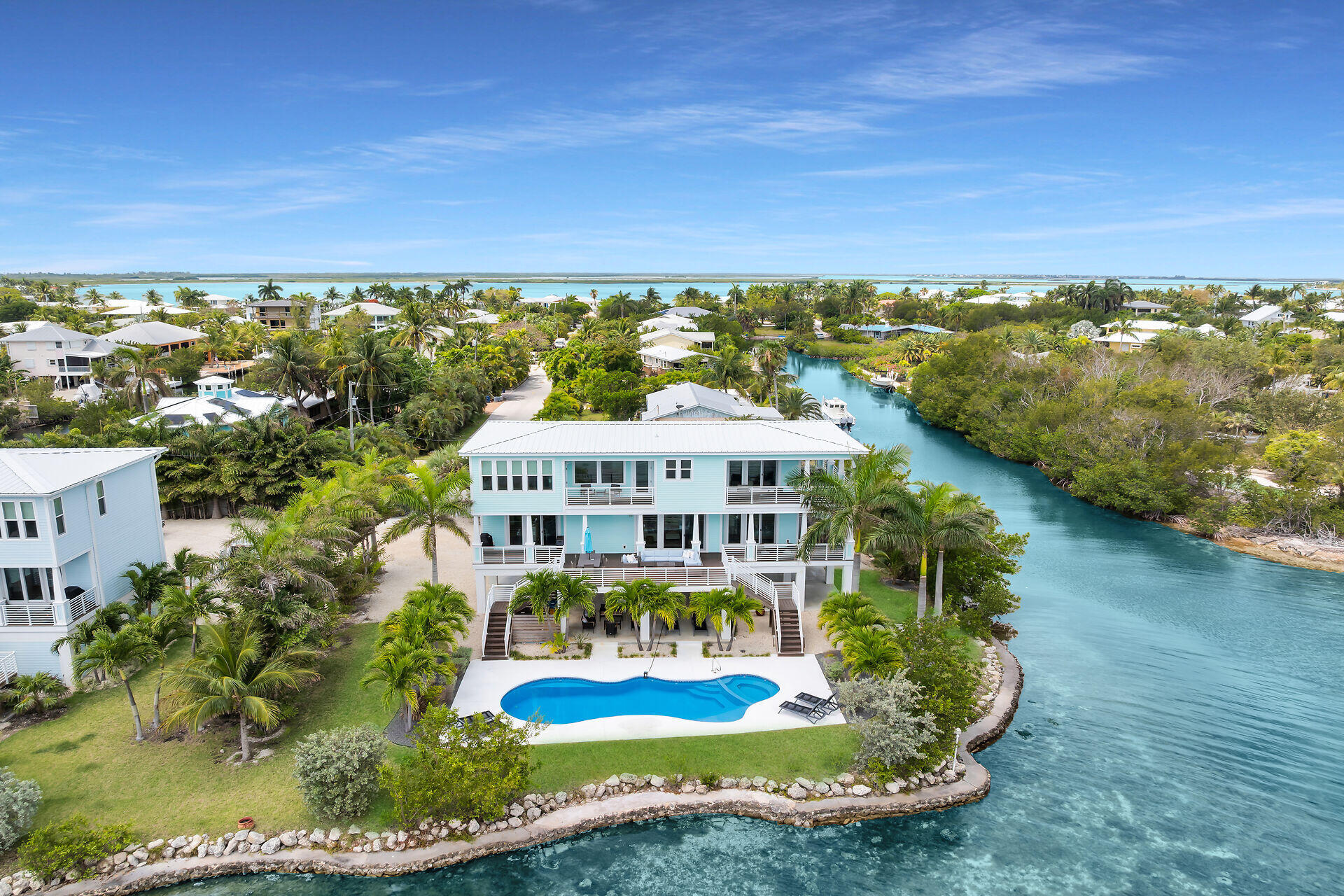 Welcome to Morning Glory - The Dolphin House, a rare direct oceanfront retreat in the Florida Keys. Situated on an oversized oceanfront lot, this 4BR/3.5BA home offers 2,478 SqFt of coastal elegance, breathtaking Atlantic views, and the peaceful lifestyle buyers dream about.  Wake up to stunning sunrises, relax by the pool beneath swaying palms, enjoy waterfront dining with guests and friends, or unwind by the fire pit under the stars. Every space was designed to feel warm, inviting, and effortlessly luxurious.  More than a home, this is a private sanctuary where memories are made and life slows down.