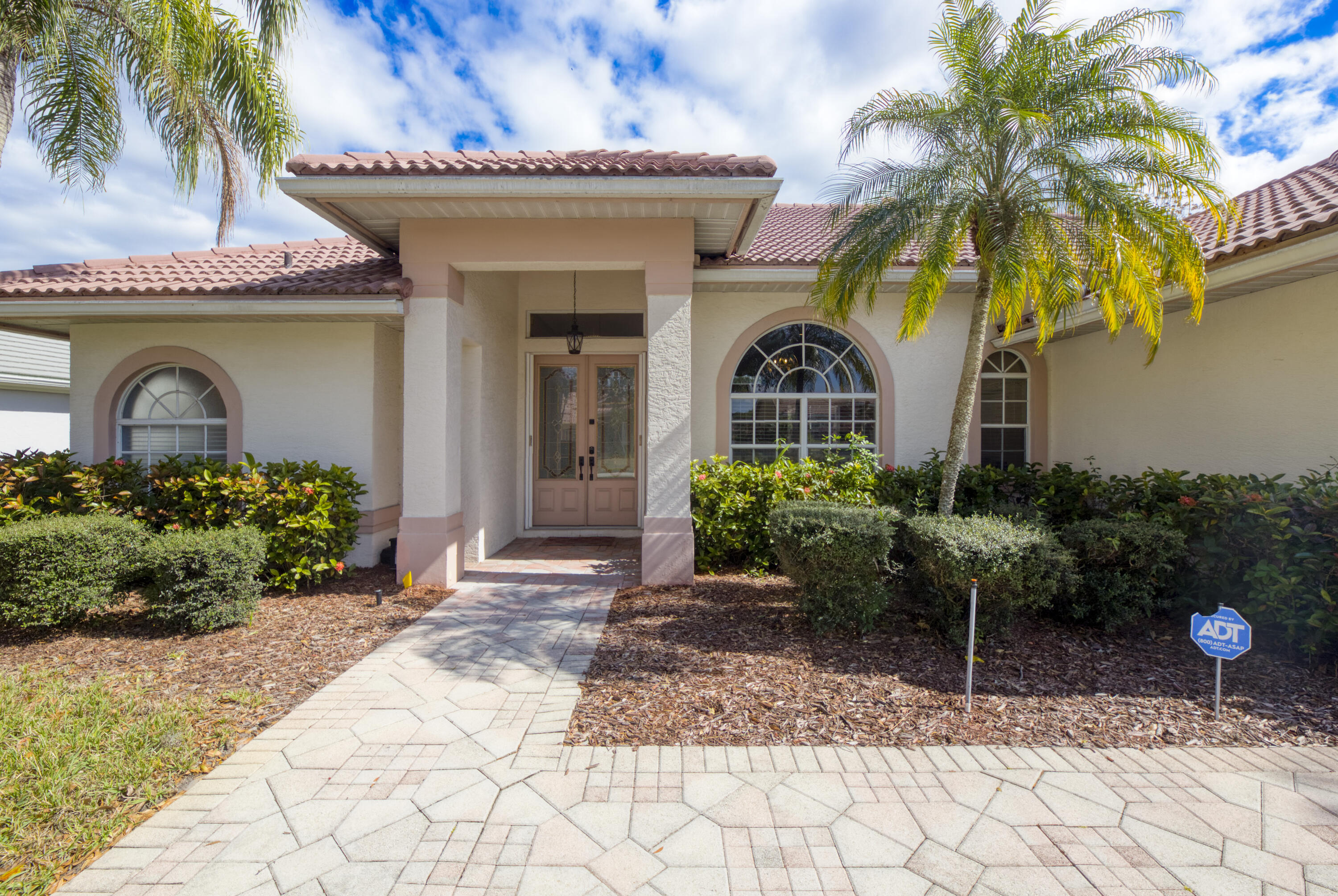 Seller agrees to pay for a new roof, to be installed Post closing on this spacious 3-bedroom, 2-bathroom home. The homes location  offers peaceful golf course views of the 15th hole at St. Lucie Trails.  Enjoy Florida living from the large screened patio, perfect for relaxing or entertaining. Located within a gated golf course community, this home features a whole-house water filtration and softener system, updated mechanicals, and a functional layout with generous living space throughout.  A great opportunity to enjoy  security, privacy, views, and comfort in a desirable Port St. Lucie setting with a low HOA.