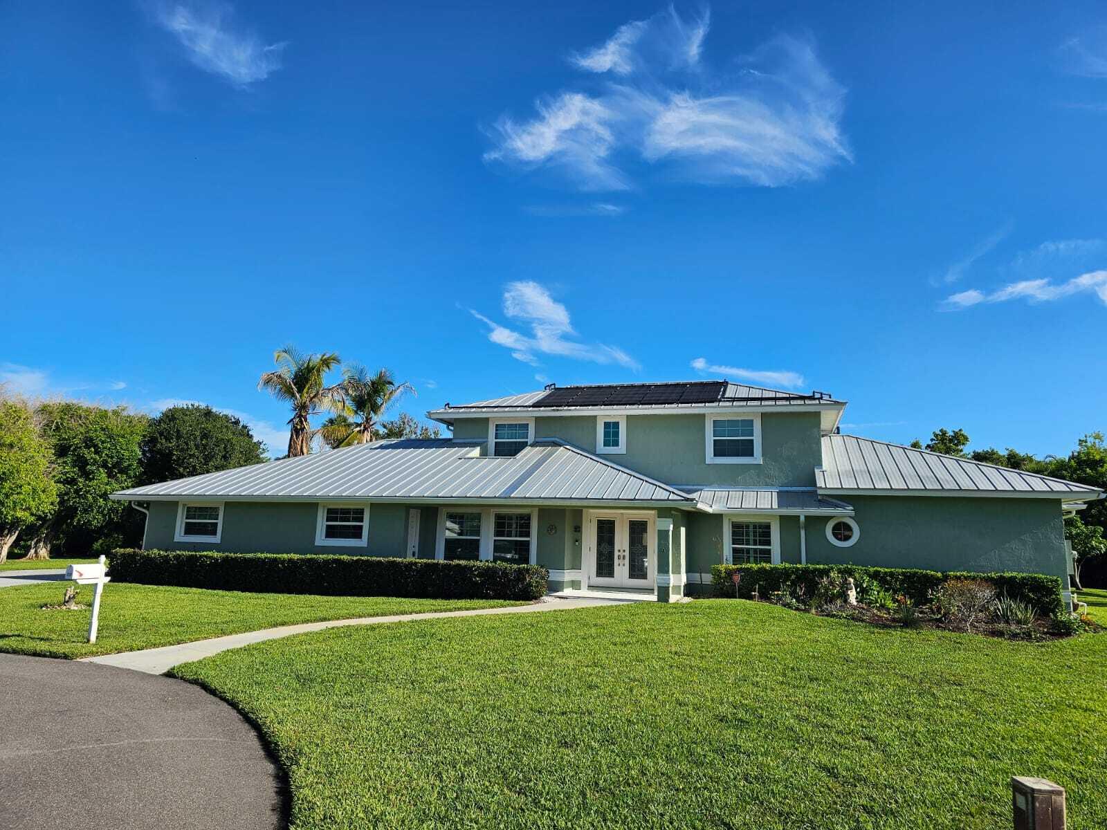 Welcome to your ultimate Florida waterfront lifestyle in the highly coveted Pilot's Cove community! This meticulously maintained 4 / 3 + 2 half bath pool home perfectly balances spacious interior living with a true boater's paradise. Boat owners will love the premium, deep-water setup: a deeded boat dock equipped with a 12,000-lb boat lift, situated in a protective no-wake zone. Enjoy seamless, fixed-bridge-free ocean access going either north or south.  The exterior features a sprawling driveway leading to a massive 3-car garage, an expansive screened lanai, a pristine pool complete with a roof-mounted solar heater, a convenient cabana half-bath, and a refreshing outdoor shower. Peace of mind comes standard with a robust dual A/C system, featuring one unit replaced in 2020 and a brand new 3.5-ton unit being professionally installed by the seller prior to closing.  A perfect blend of comfort, major mechanical updates, and elite waterfront convenience—get ready and schedule your tour today as we schedule showings for the weekend starting 7/30/26!