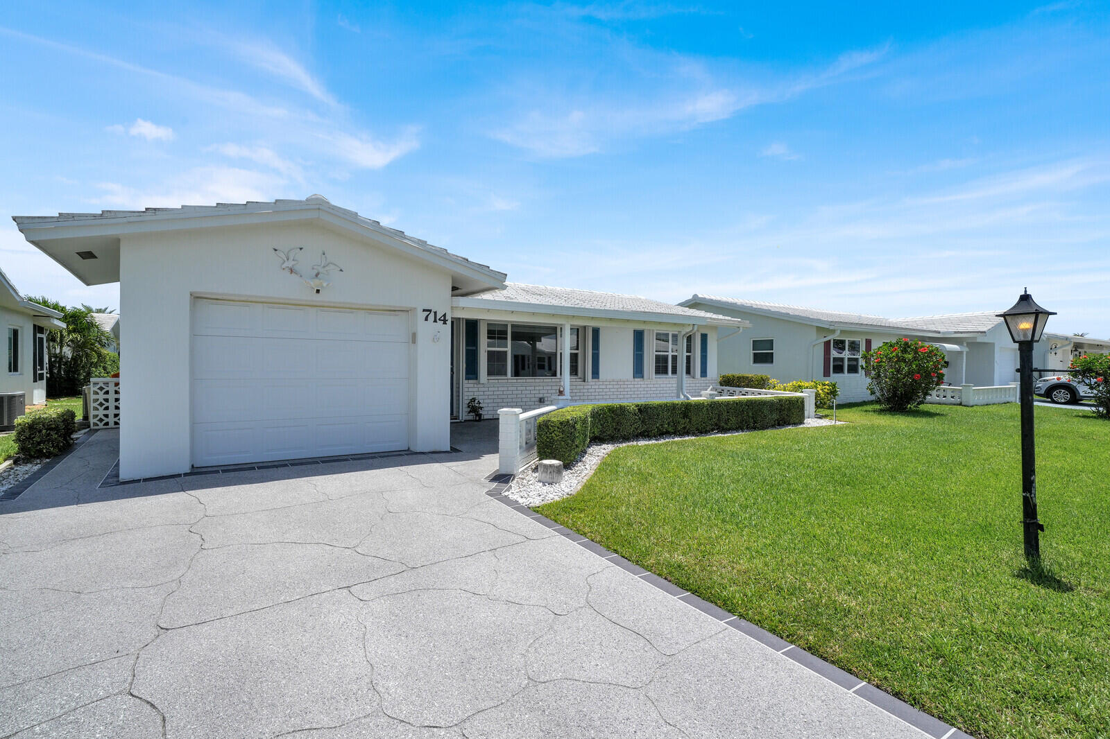 Immaculate and beautifully updated single-family home in desirable 55+ Palm Beach Leisureville! This move-in ready residence offers a spacious oversized living room/great room, a finished Florida room providing additional living space, and new tile flooring. The well-maintained home features a one-car garage, washer and dryer, and a large veranda perfect for enjoying your front porch. Major updates include a 2010 roof, 2018 A/C system, and stainless steel appliances installed in 2020. A solar panel system helps keep utility costs low, adding exceptional value and efficiency. Enjoy the active Palm Beach Leisureville lifestyle with low HOA fees and access to outstanding amenities, including a clubhouse, community activities, and golf. Conveniently located near shopping and dining.