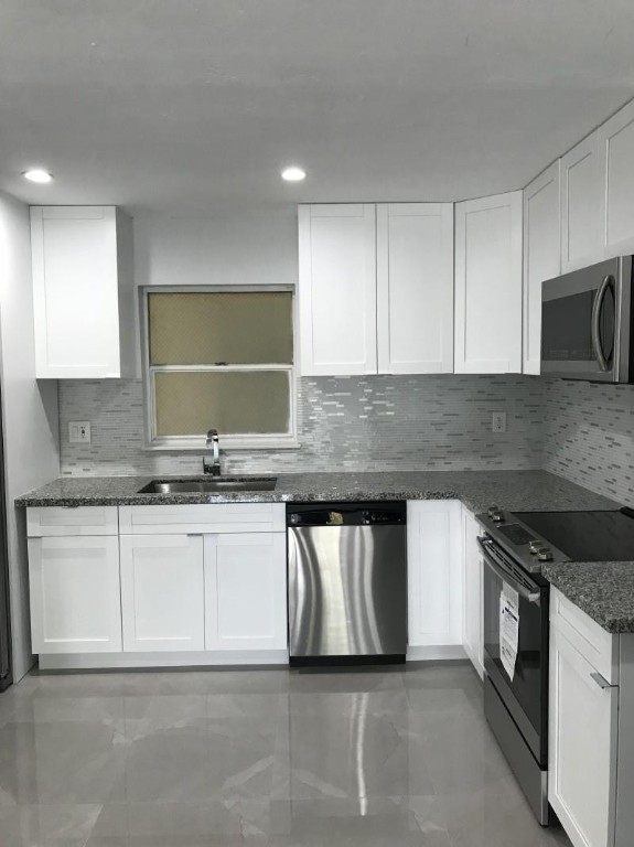 LOCATION! LOCATION! Ample corner unit in a quiet neighborhood, immediately behind Dadeland mall.  Walking distance to fine dining, shopping, and entertainment.  University of Miami,  Metro Rail mover, and the highway just minutes away. This unit was completely and tastefully remodeled just two years ago.  All kitchen appliances were replaced at that time, also in-unit washer and dryer.  New electrical panel was also installed.  This building has a brand new roof as of 2021, when it was also painted.