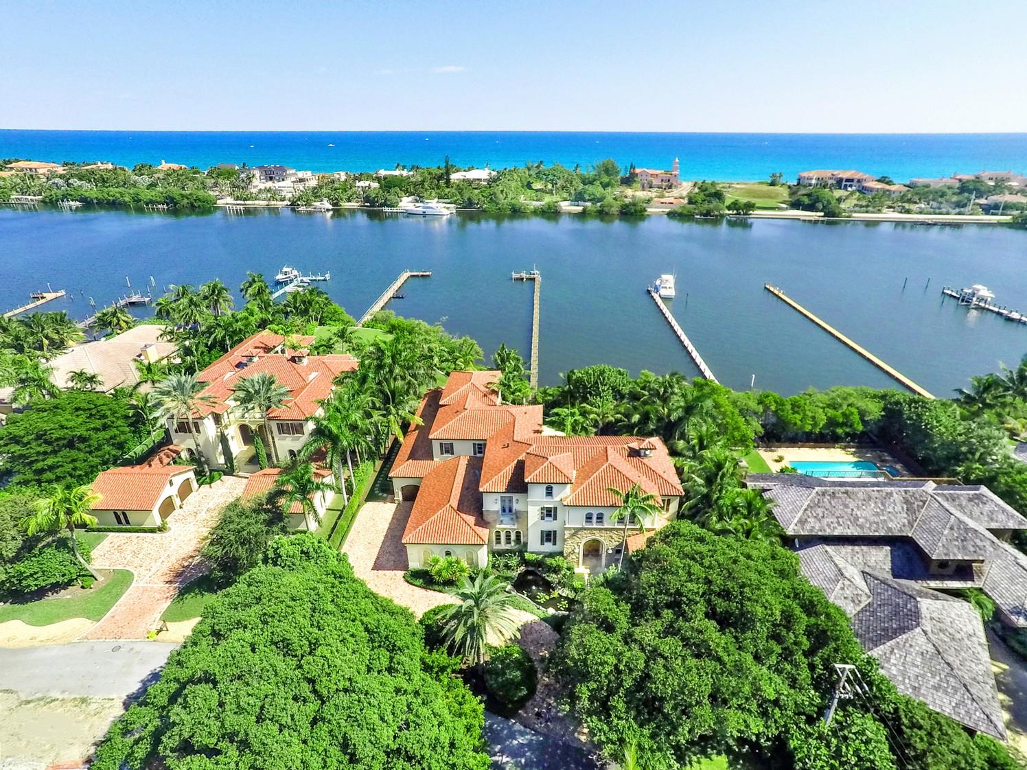 Furnished in transitionally contemporary style, this private waterfront estate features east exposures overlooking expansive ICW waterways and ocean vistas from the second story.  A dramatic entry opens to a two story experience of height and grandeur with a sweeping staircase and intimate  living room showcasing the gorgeous pool patio area and water vistas.  A first floor media/club room with entertainment bar and billiards area, private dining room and wine area, a true chef's kitchen with spacious breakfast/lunch table also sensational views and opens to the full size family room.  A 1st floor BR suite and guest suite complete the interior level one. See MORE Tab. Pool/spa/waterfall, & covered patio;  boat dockage up to 60ft and jet skis.  Upstairs are the MBR, three BR suites & ENT loft area. Furniture offered is available to be purchased but separate. Property's official address is Lantana but for search properties we have listed it as Manalapan.
