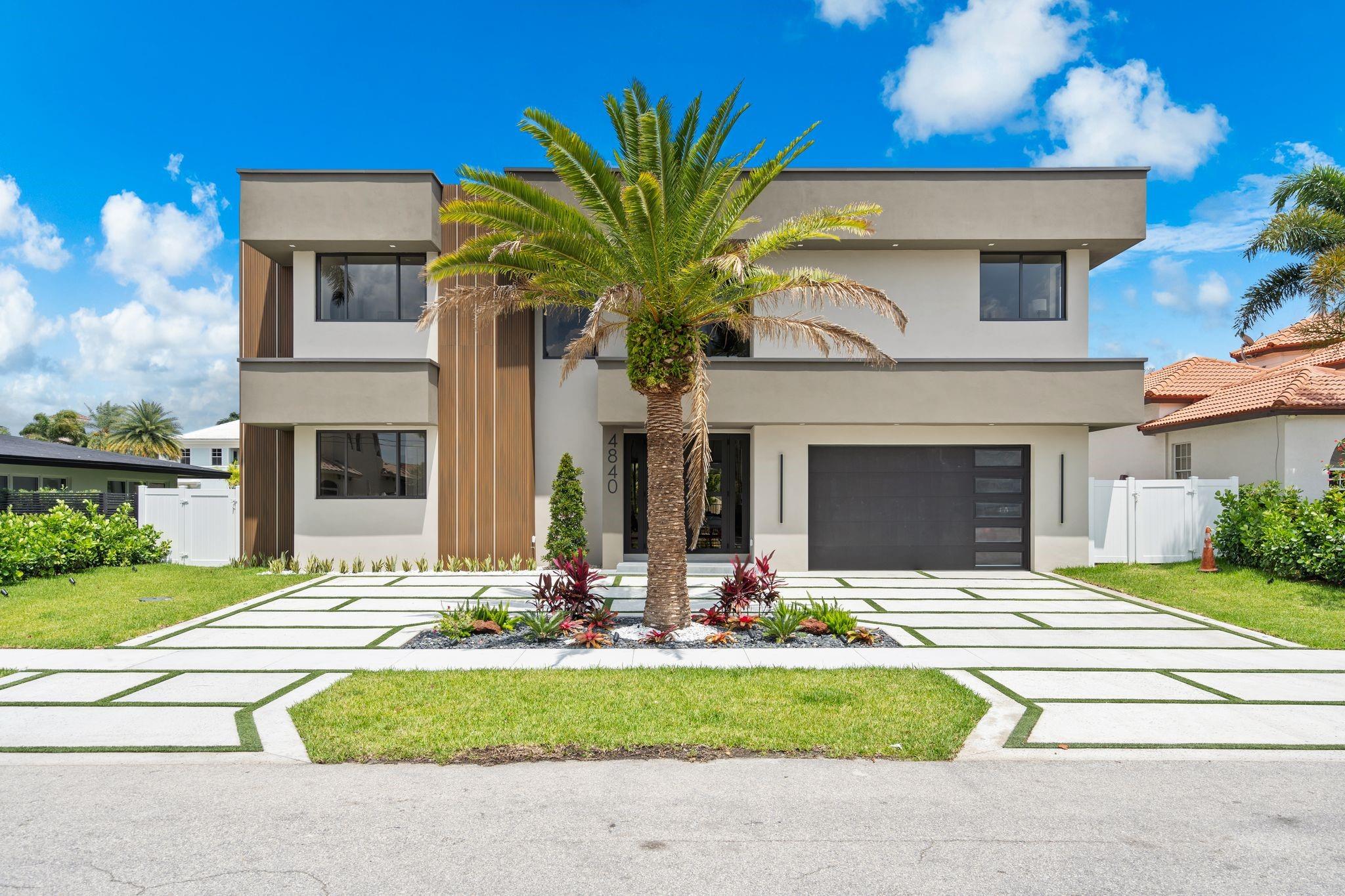 This brand New Coastal Modern Estate in Lighthouse Point is situated on 80' of deep water with direct ocean access. Built by Pacific Contractors, this custom residence is outfitted with modern conveniences hidden by exquisite design. The two story home boasts 5 bedrooms & 6.5 bath along with incredible outdoor space. Right when you enter you notice the 12' ceilings & expansive glass sliding wall providing indoor/outdoor living. The first level includes the main bedroom with two oversized closets completely built out, an open kitchen layout complete with butler pantry/laundry space. The second level includes a spacious family loft area, four bedrooms, & a massive balcony overlooking the water. Garage height allows for 4 post lift. Out back you will find a new concrete dock & outdoor kitchen