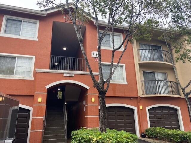 Brand New Kitchen Cabinets, dishwasher, microwave ,flooring and stairs Freshly painted ,Rarely found ,Large 3 Bedroom 2 Bathroom Condo with a GARAGE! All tile and laminate flooring .Great location , many amenities included. Gated Community Features a Pool, Clubhouse with fitness center and much more! Central location Close to Palm Beach outlets,Downtown,I95 and Turnpike.