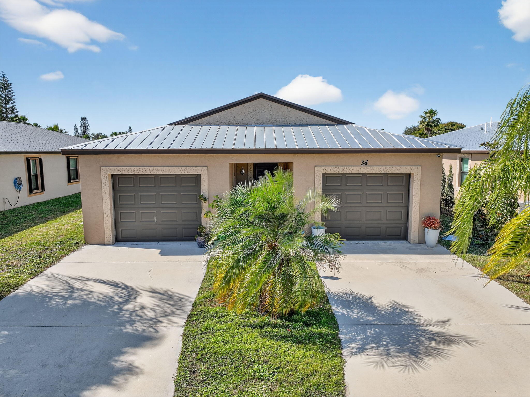 CBS RETREAT! This 3BR/2BA home offers resort living at an unbeatable value. Built for peace of mind, the residence features a durable METAL ROOF, IMPACT WINDOWS and PLANTATION SHUTTERS. Relax on the oversized screened porch in a quiet, manicured setting. LIFESTYLE: GOLF, 2 heated pools, tennis, pickleball, and a vibrant clubhouse. Land-Lease, lot rent covers lawn, trash, and all amenities — Stainless appliances, granite, and cherry cabinets. Minutes from beaches and PGA Village. Start your dream lifestyle now!